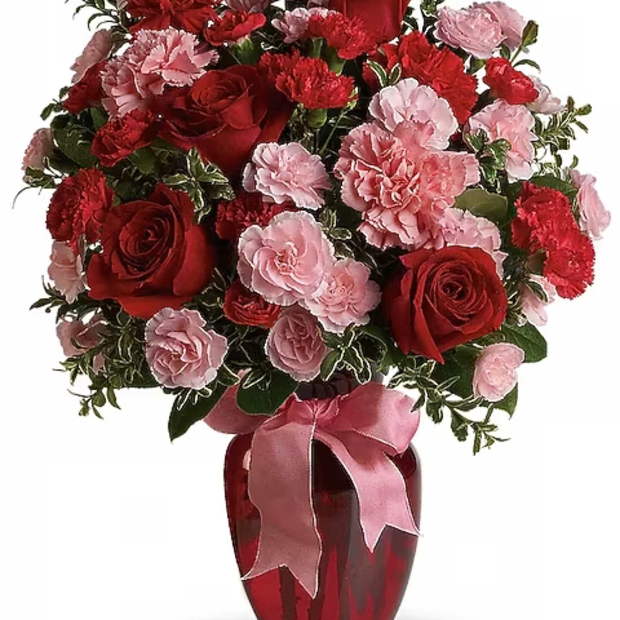 Red roses and pink carnations in a red vase with a pink ribbon