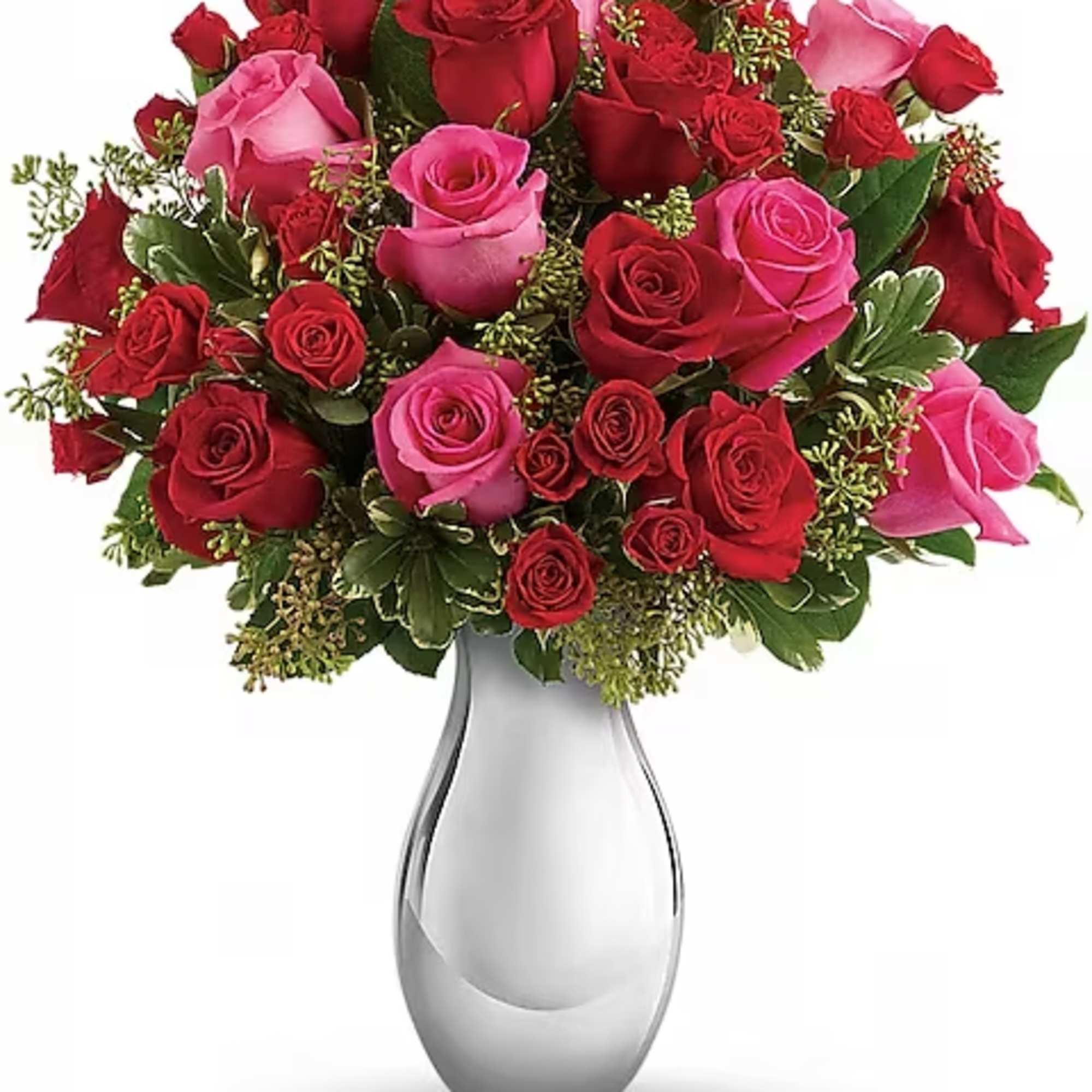 Bouquet of red and pink roses in a silver vase