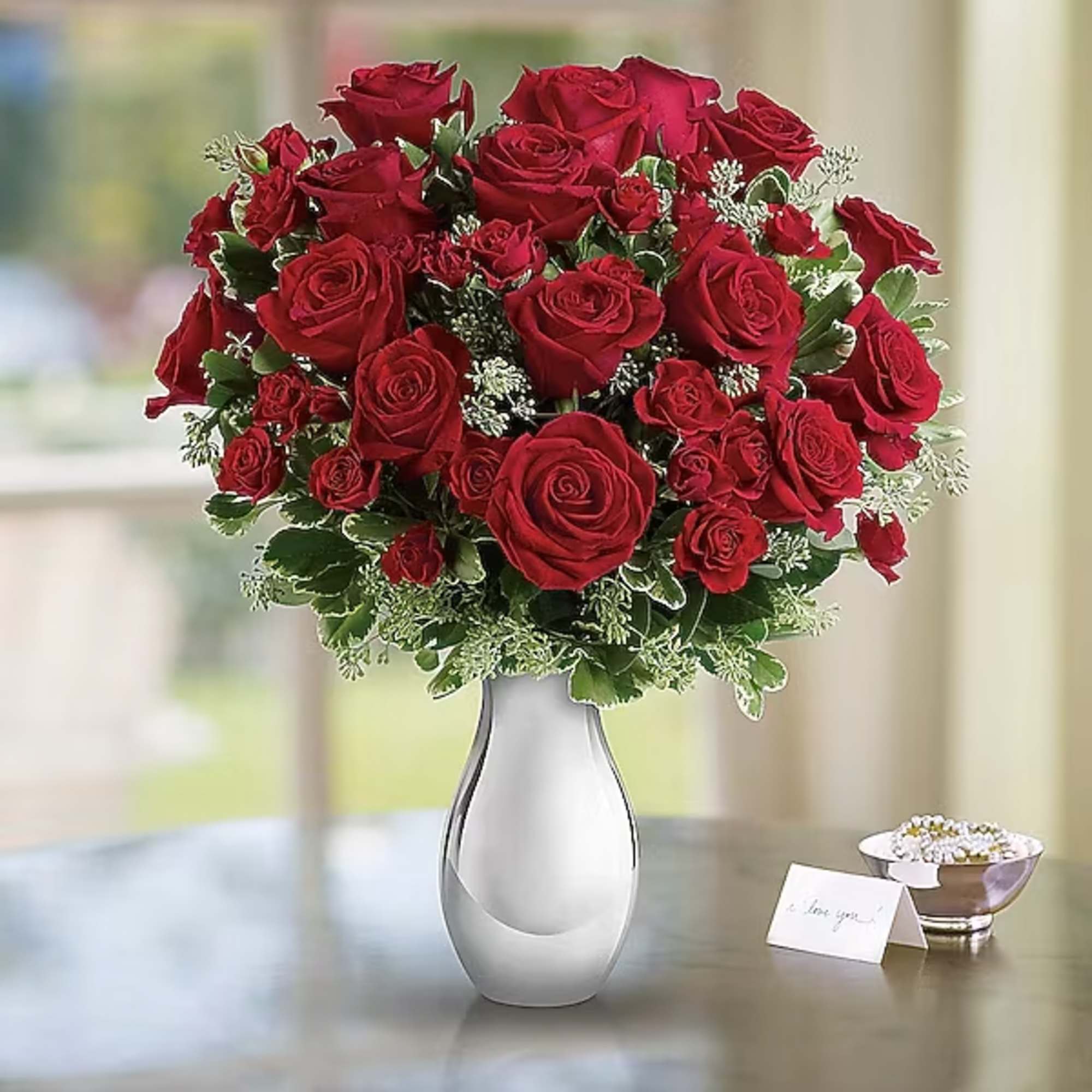 Bouquet of red roses in a clear glass vase