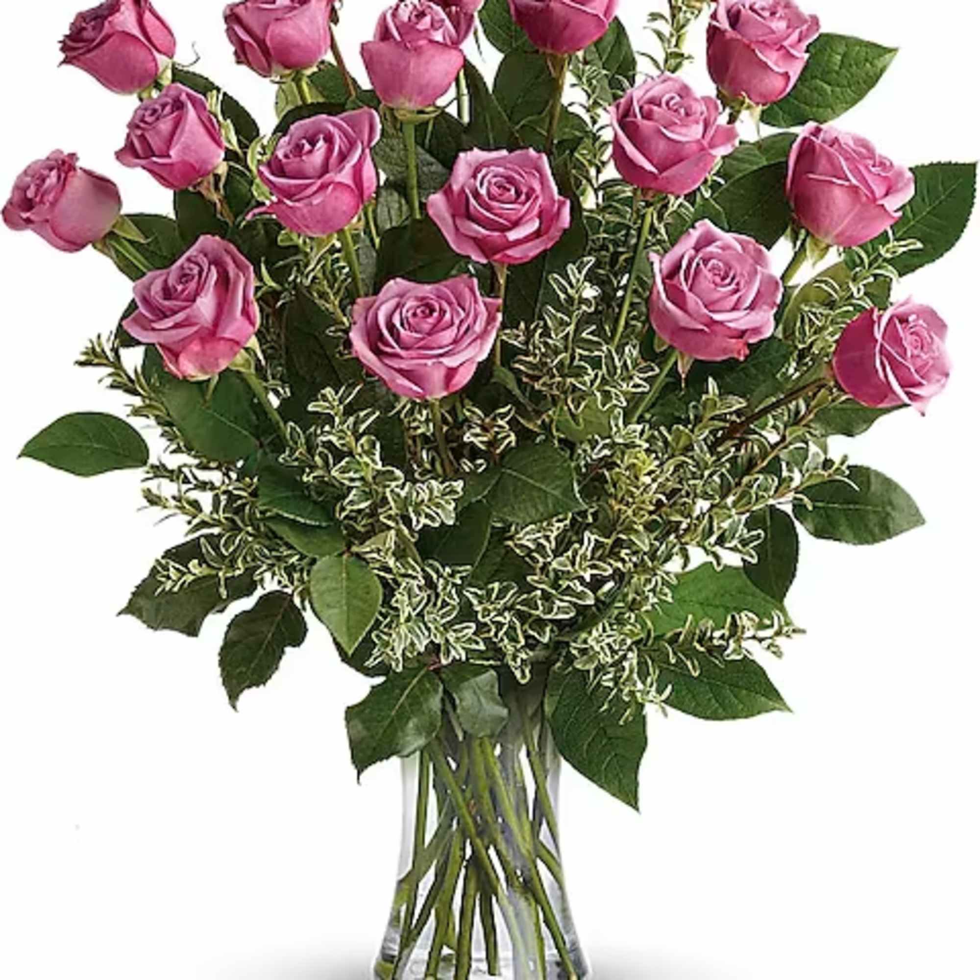 Pink roses arranged in a clear glass vase