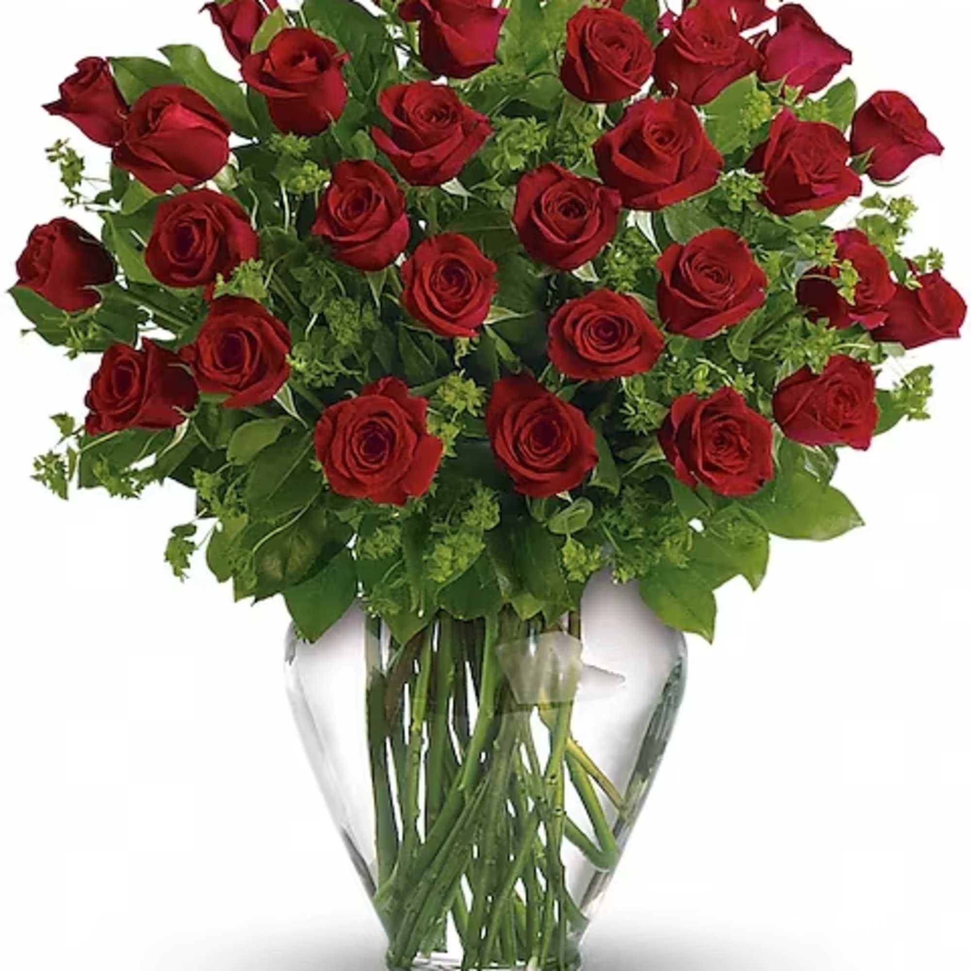 Red roses arranged in a clear glass vase