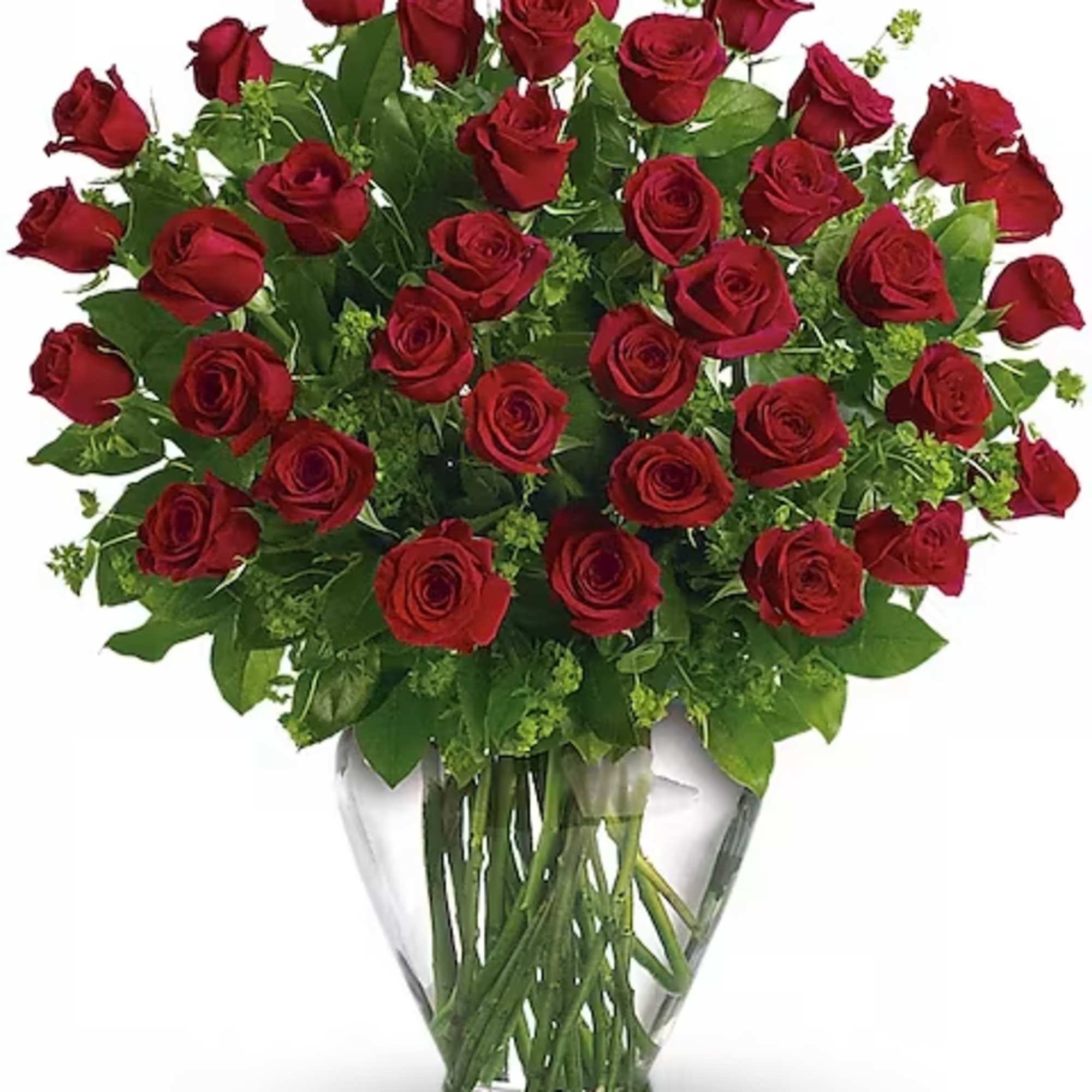 Red roses arranged in a clear glass vase