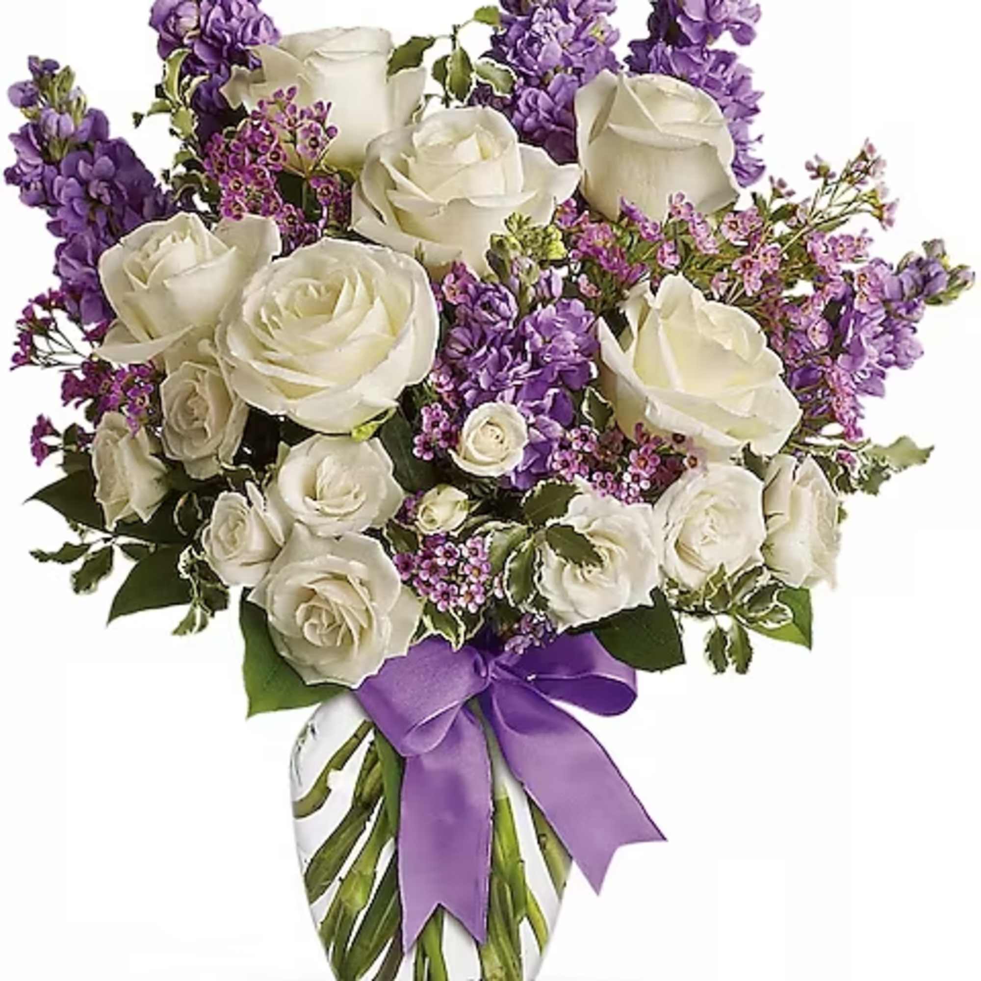 Vase arrangement of white roses with purple flowers and a purple ribbon bow