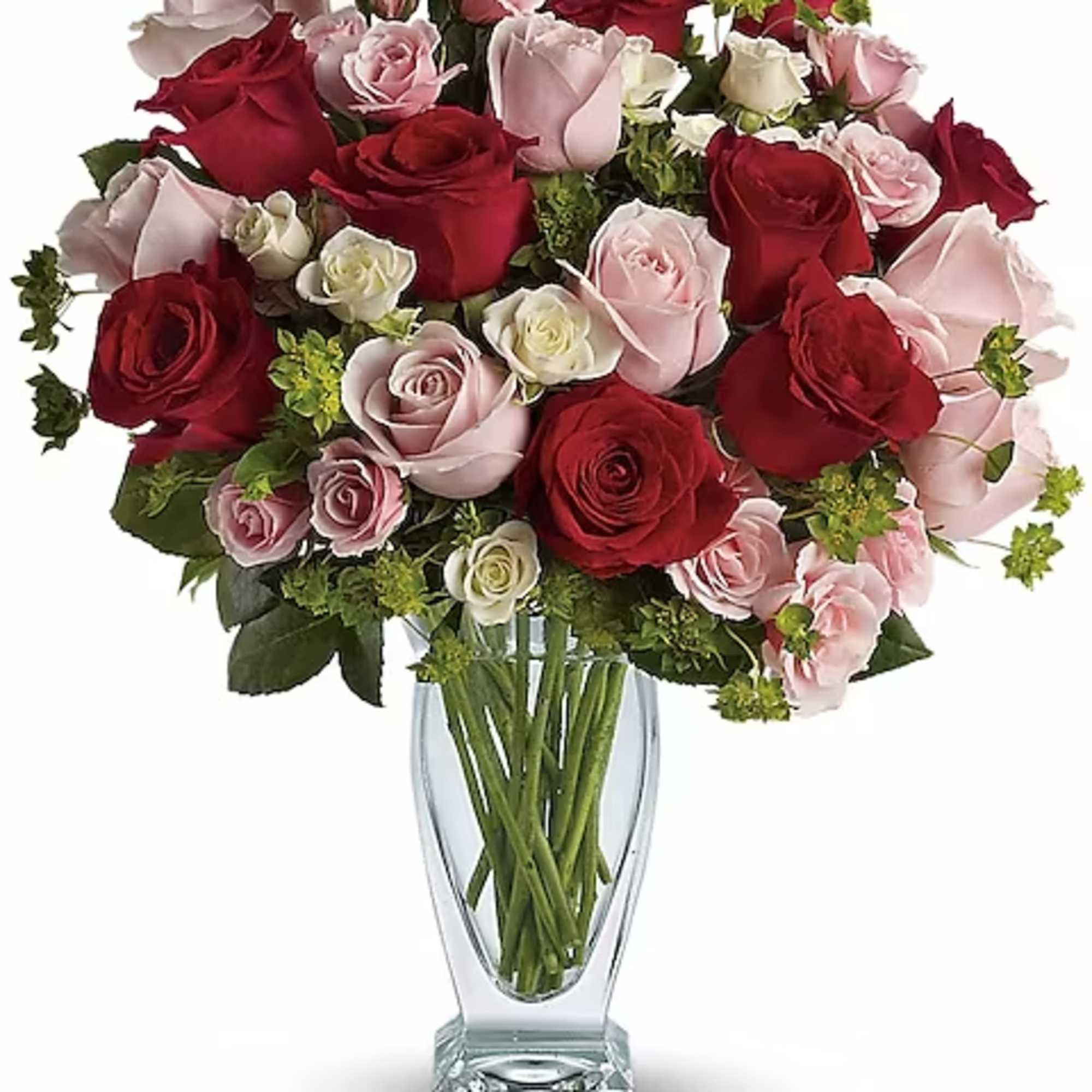 Bouquet of red and pink roses in a clear glass vase
