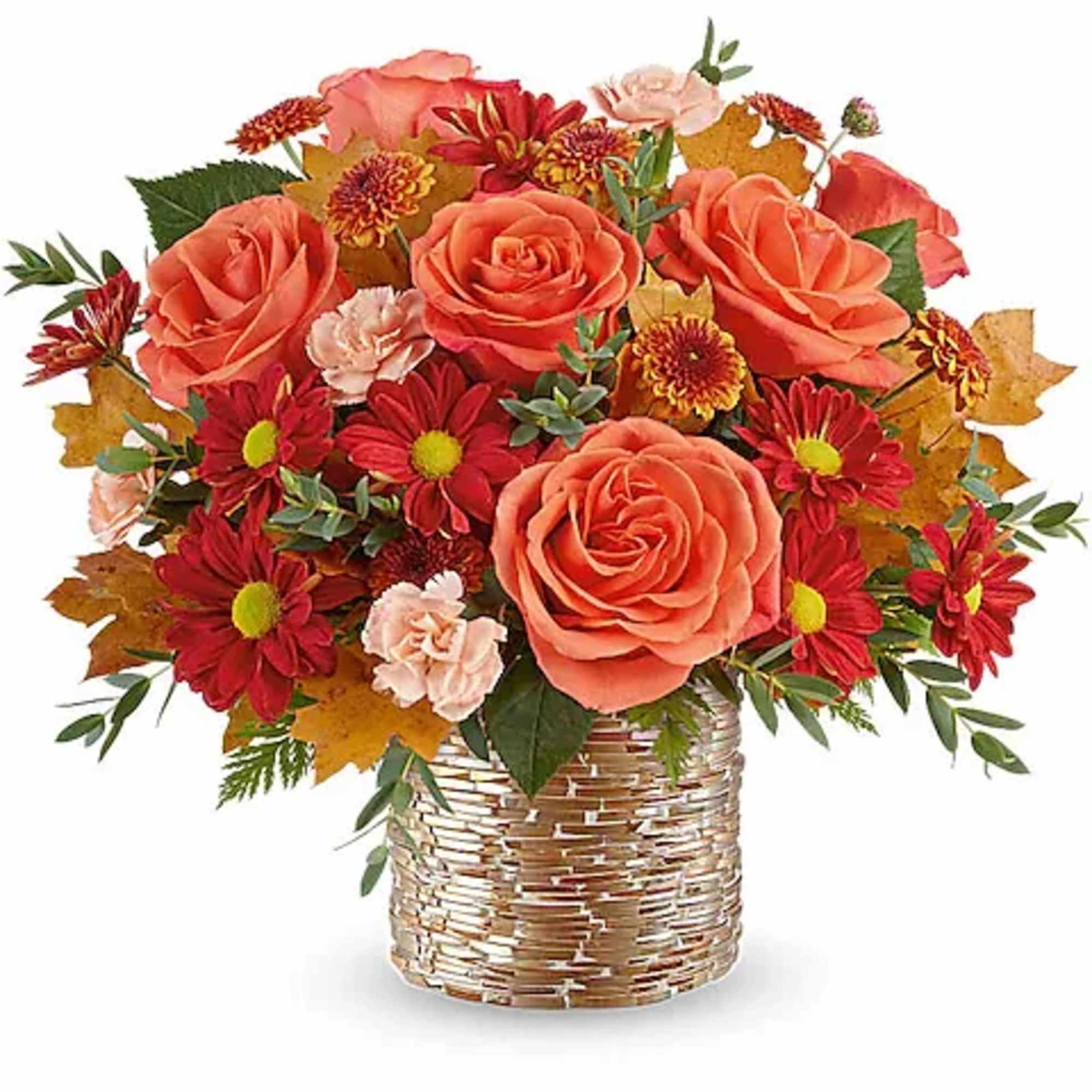 Bouquet of coral roses and red daisies in a woven basket vase