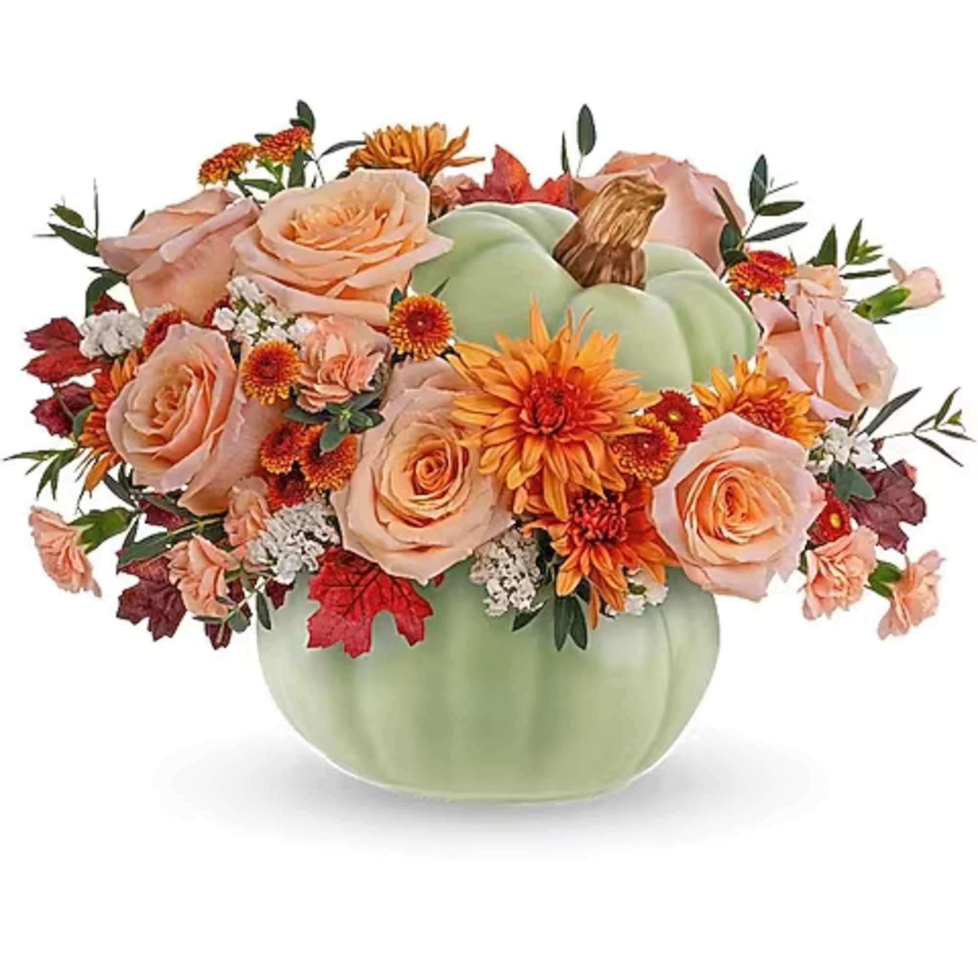 Peach roses and orange flowers arranged in a green pumpkin vase