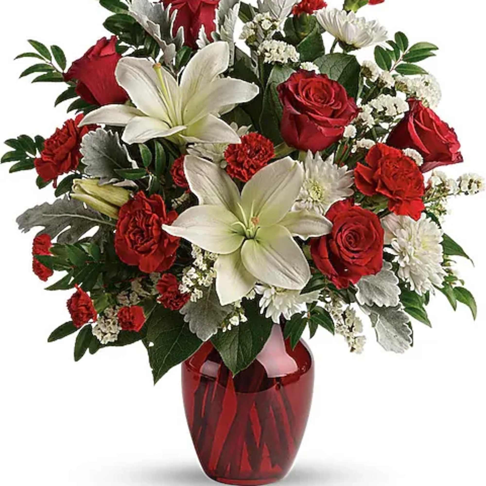 Red roses and white lilies in a red glass vase