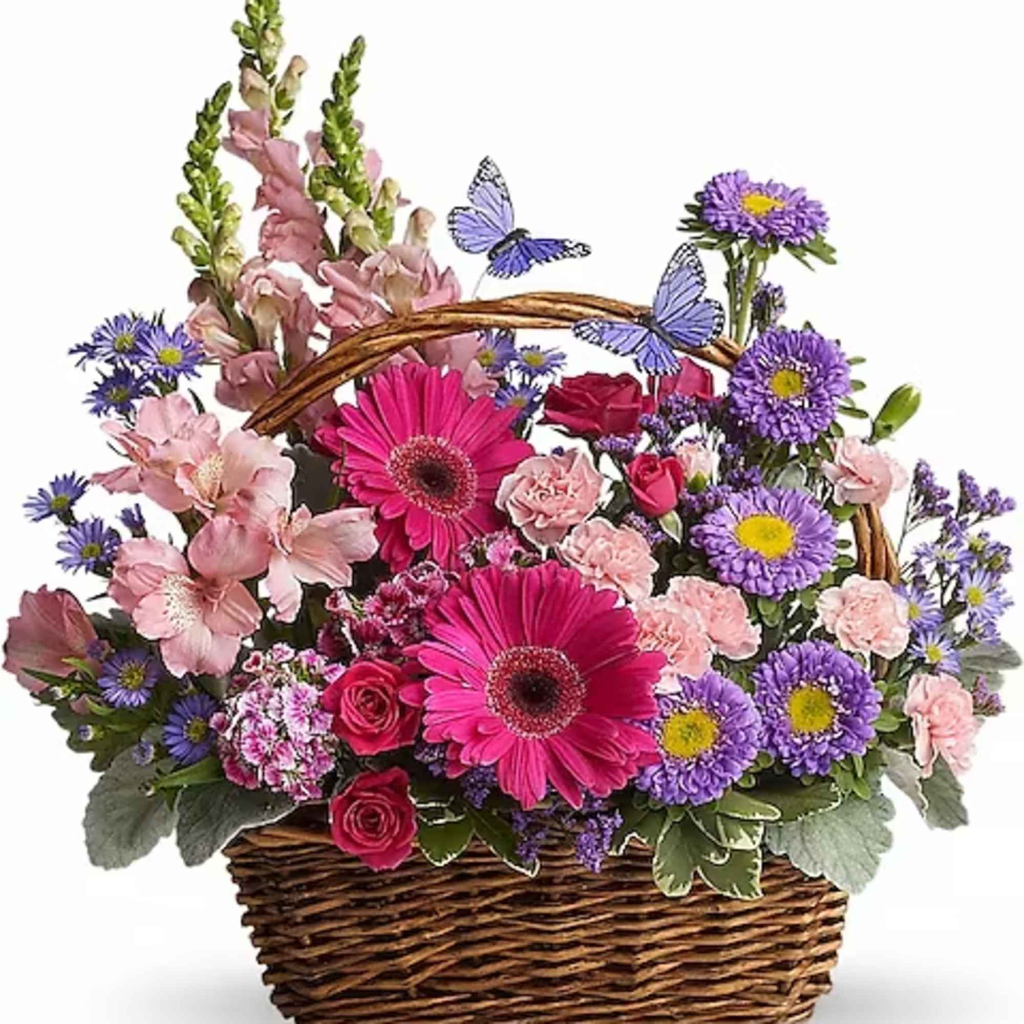 Basket arrangement of pink and purple flowers with butterfly picks