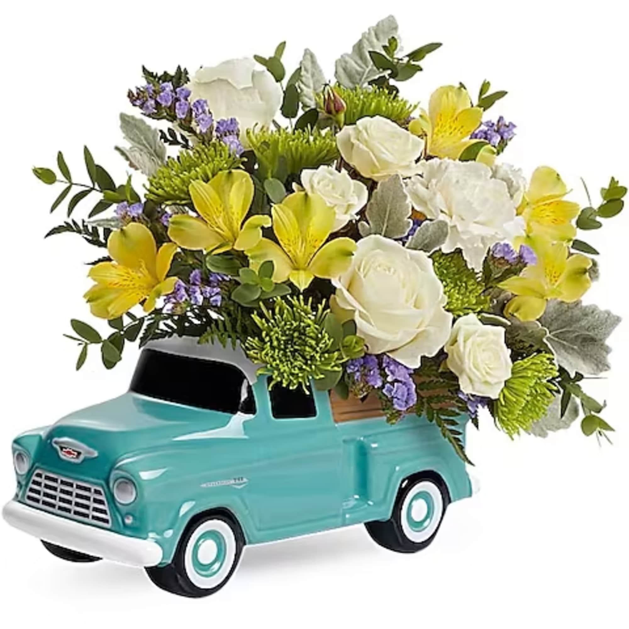 White and yellow floral arrangement in a turquoise vintage truck planter