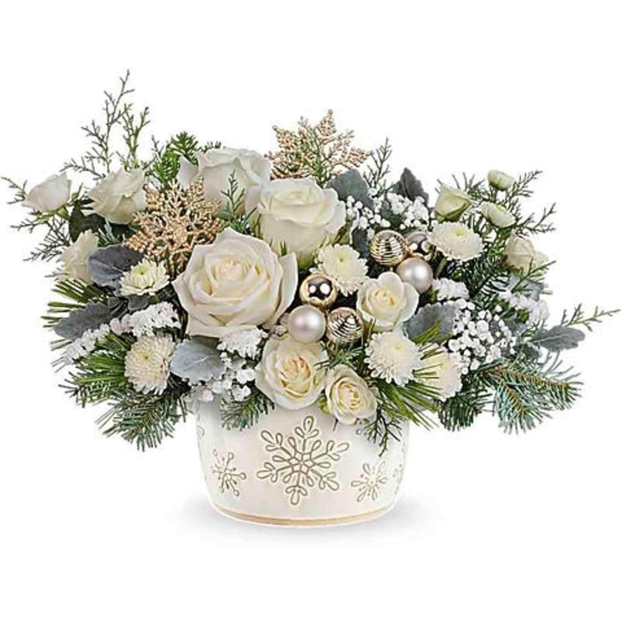 White rose arrangement in a snowflake-decorated vase