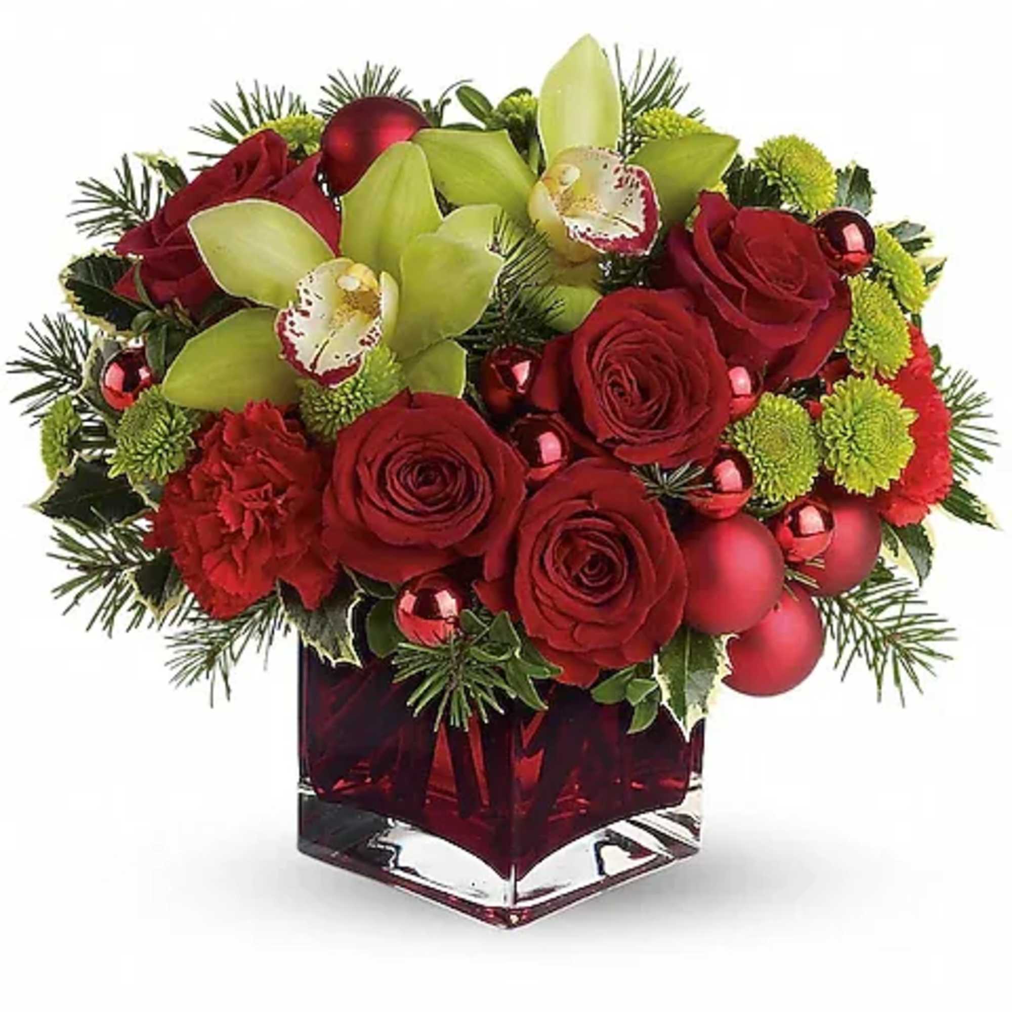 Red roses and green orchids in a square glass vase with ornaments