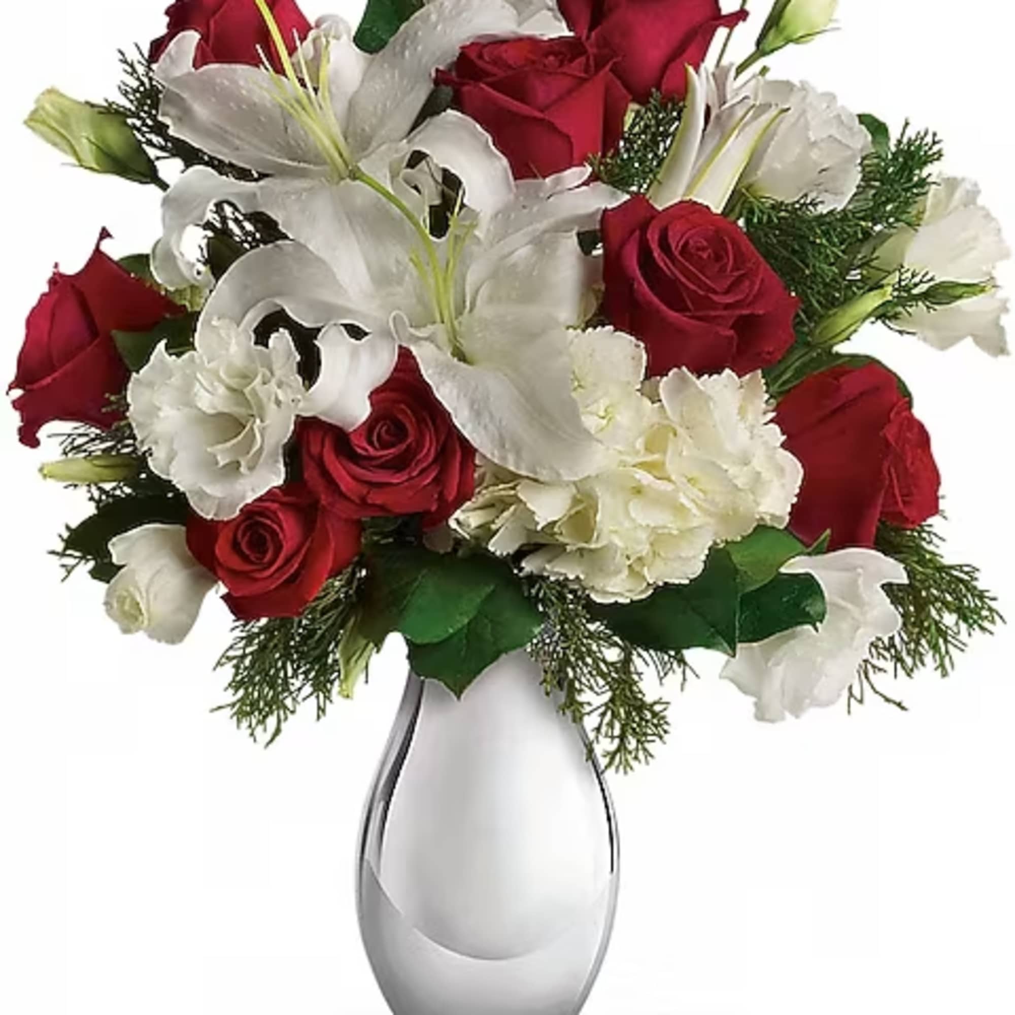 Red roses and white lilies arranged in a clear glass vase