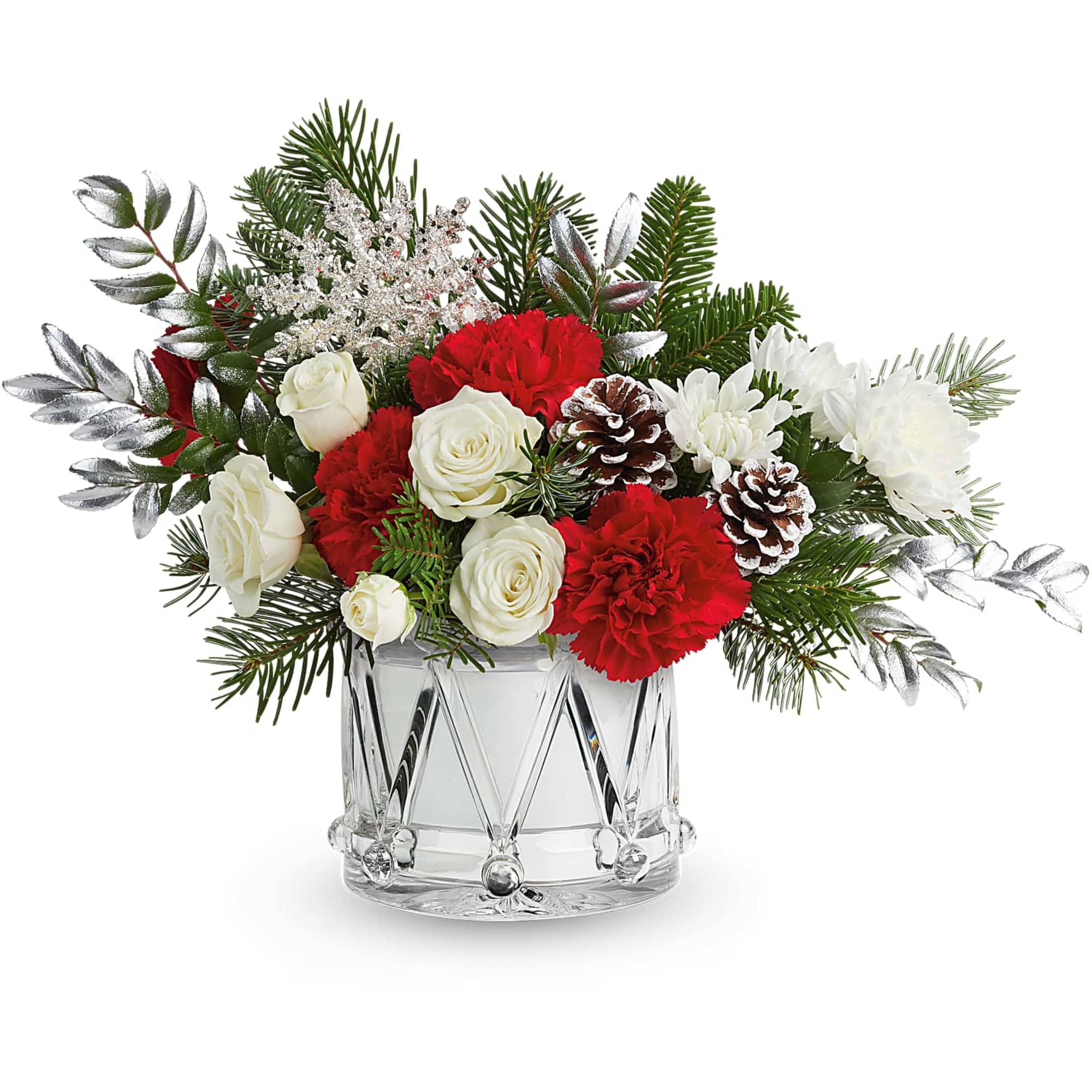 Red and white floral arrangement in a clear glass vase with pinecones
