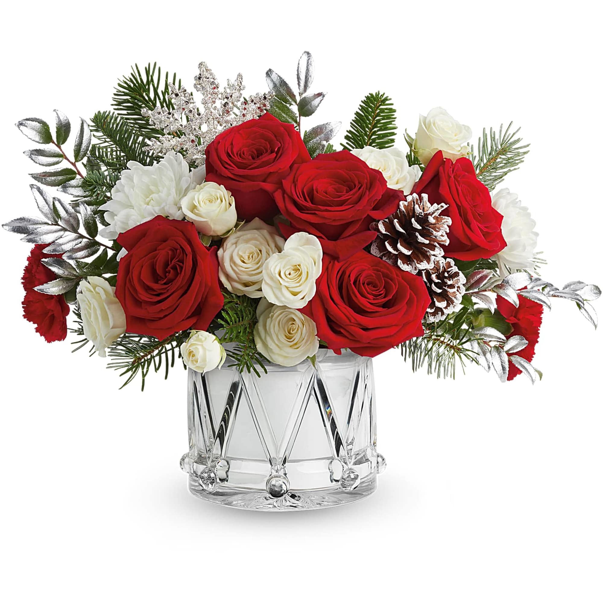 Red and white roses arranged in a clear glass vase with pinecones and evergreen sprigs