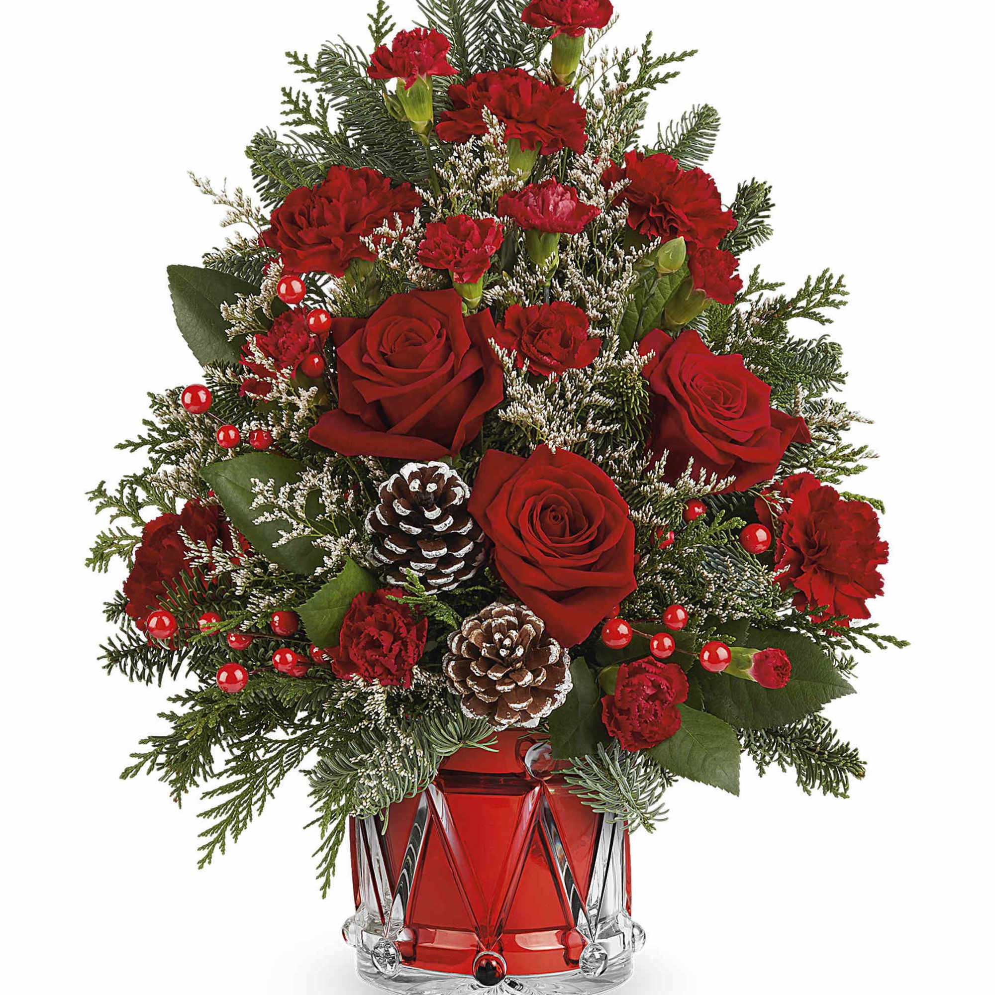 Red roses and carnations in a red glass vase with pinecones