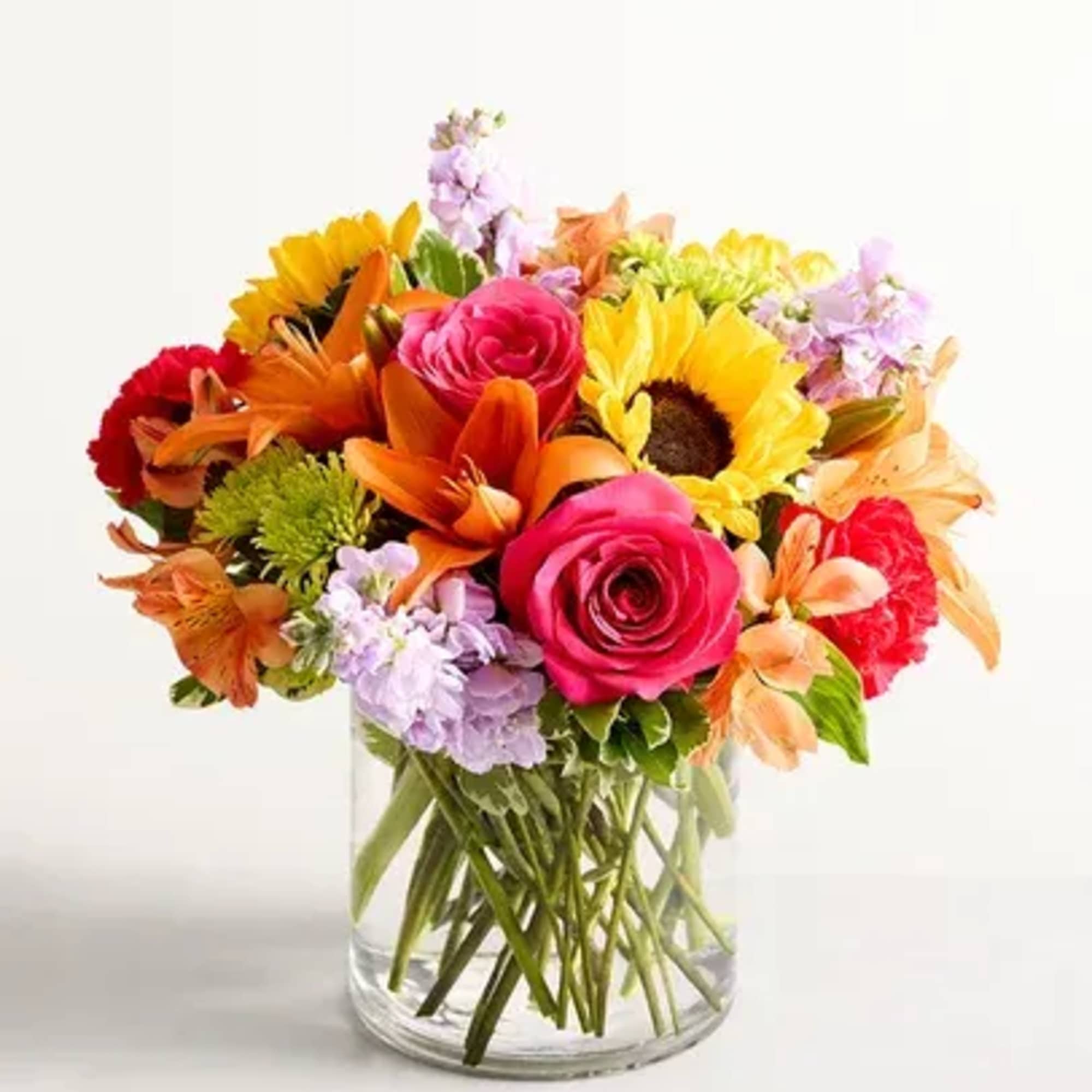 Colorful mixed bouquet in a clear glass vase