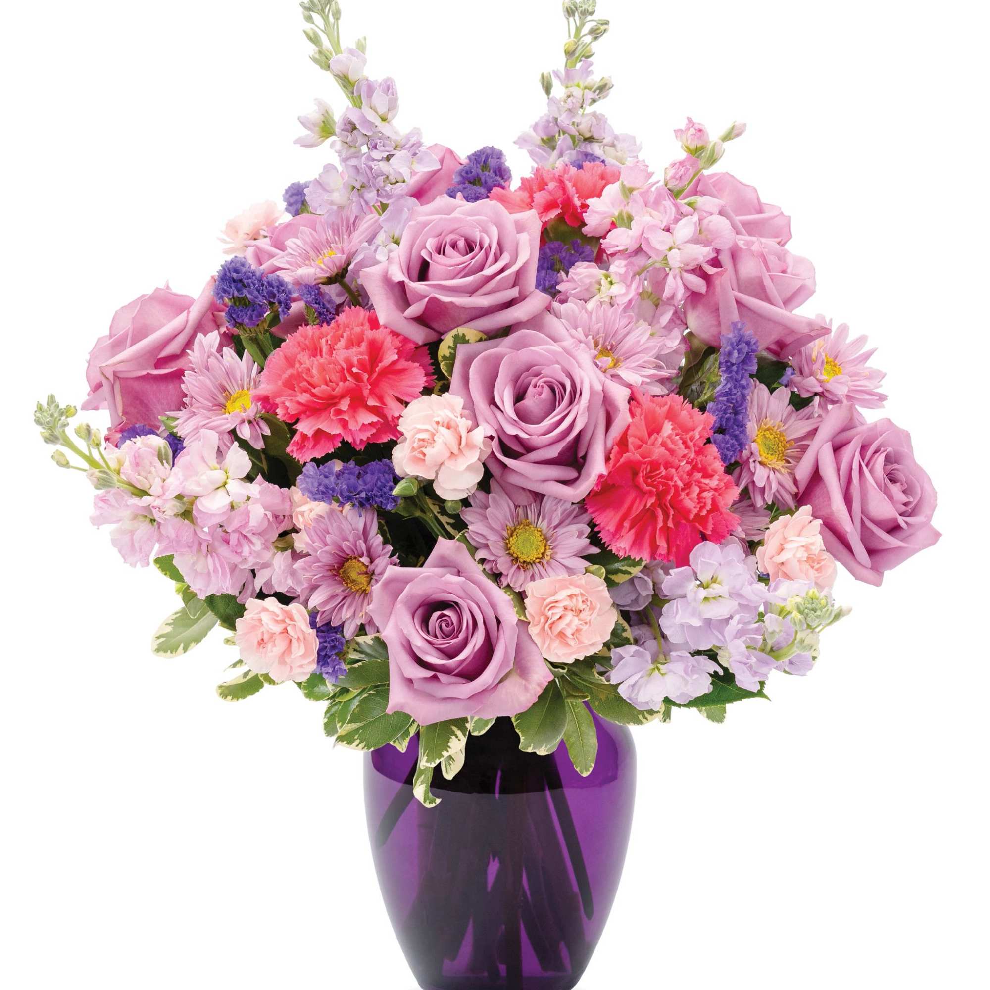 Lavender and pink mixed flower arrangement with roses and carnations in a purple glass vase