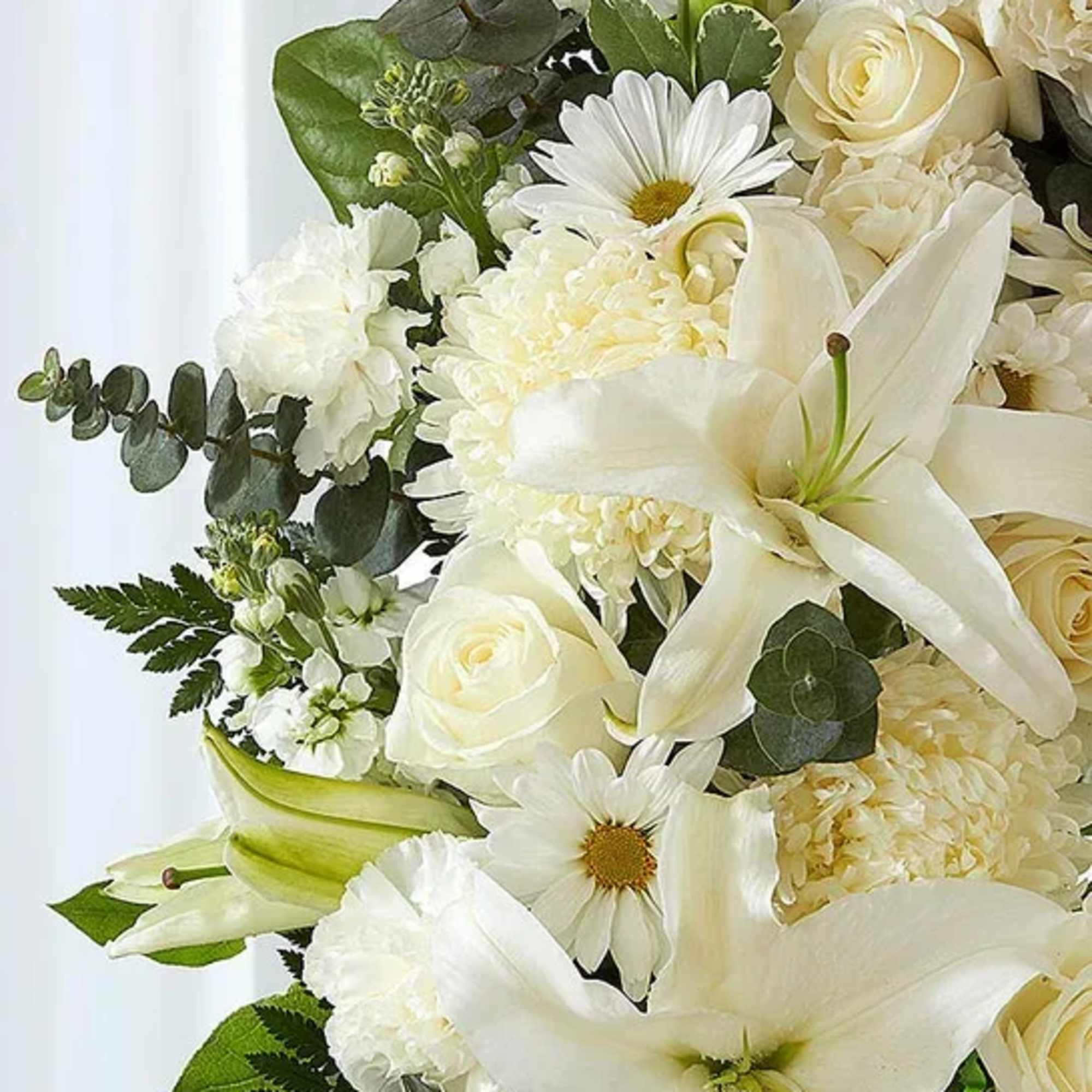 White bouquet with lilies, roses, daisies, and hydrangeas