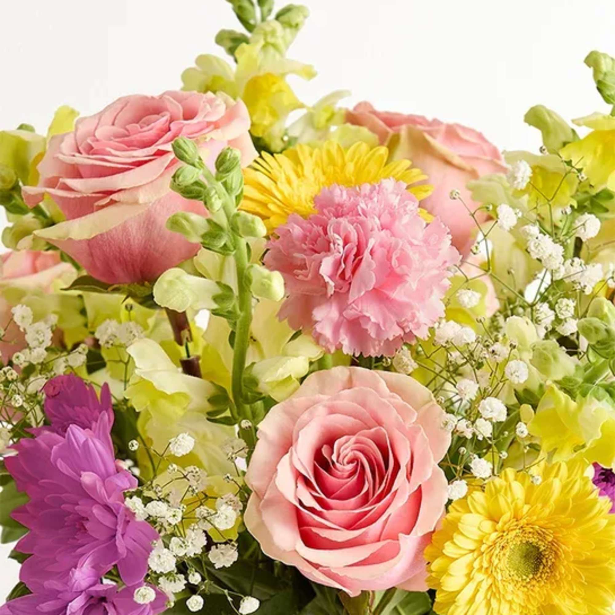 Bouquet of pink roses, yellow daisies, and purple flowers