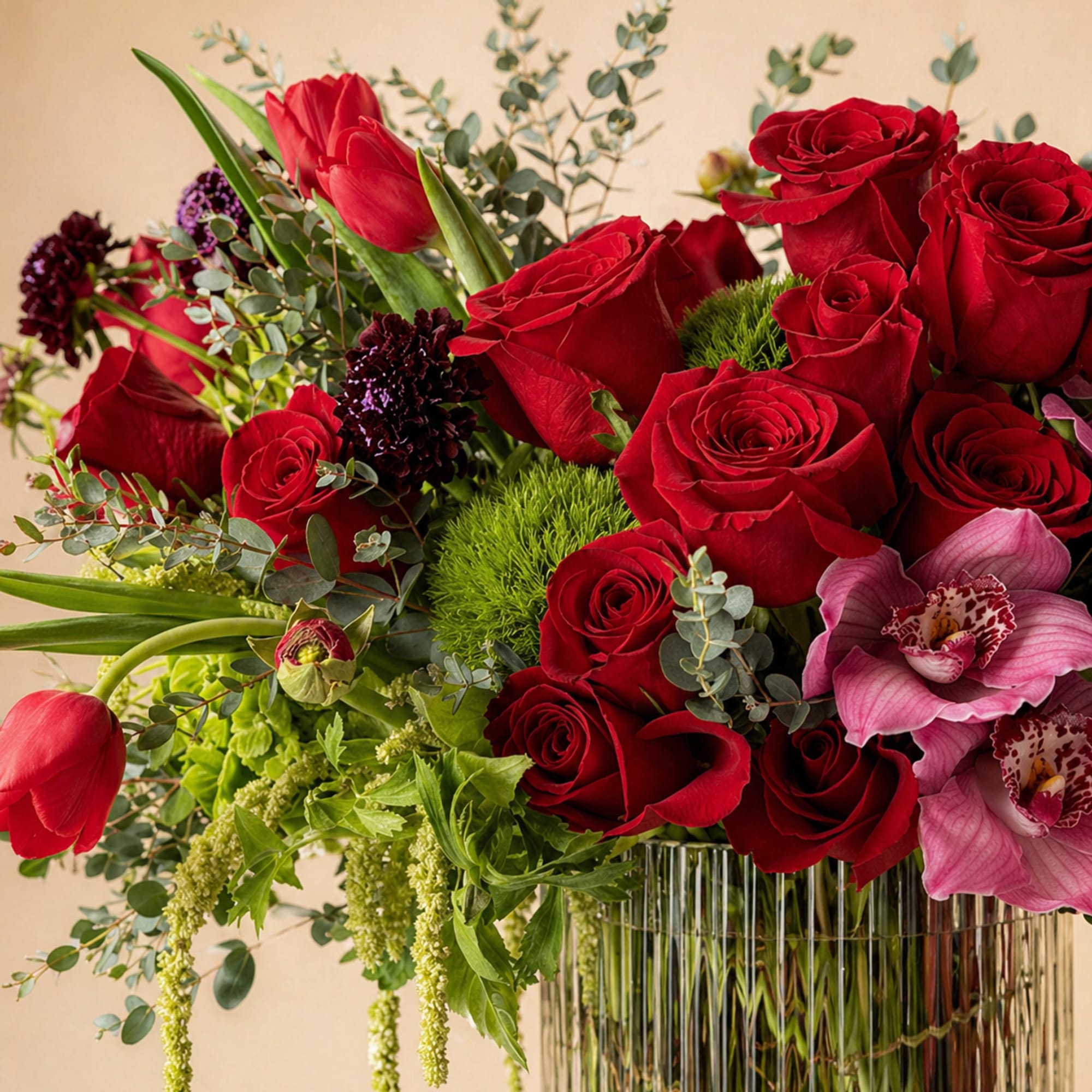 Beautiful one-sided flower arrangement with red mix blooms. This arrangement is built