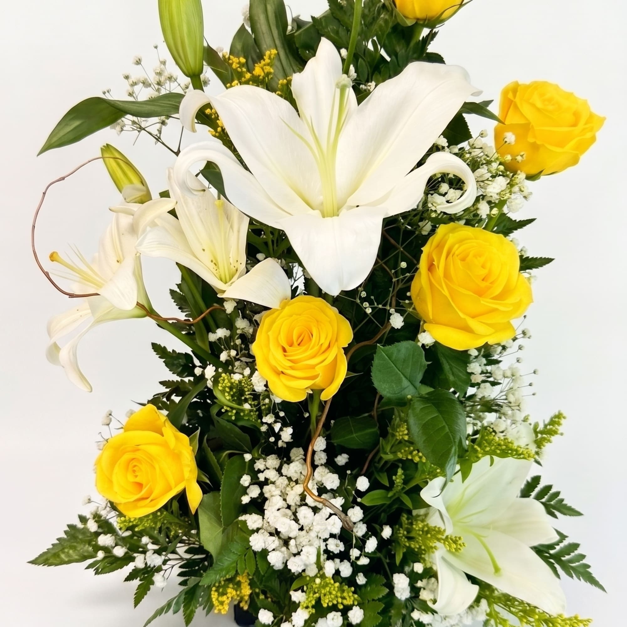 6 Yellow Roses delicately accented with white Lilies and Babies Breath make