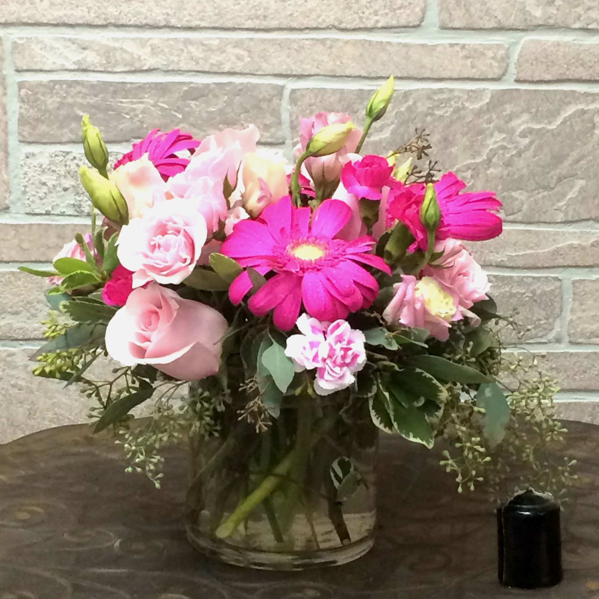 Pink and white mixed bouquet in a clear glass vase