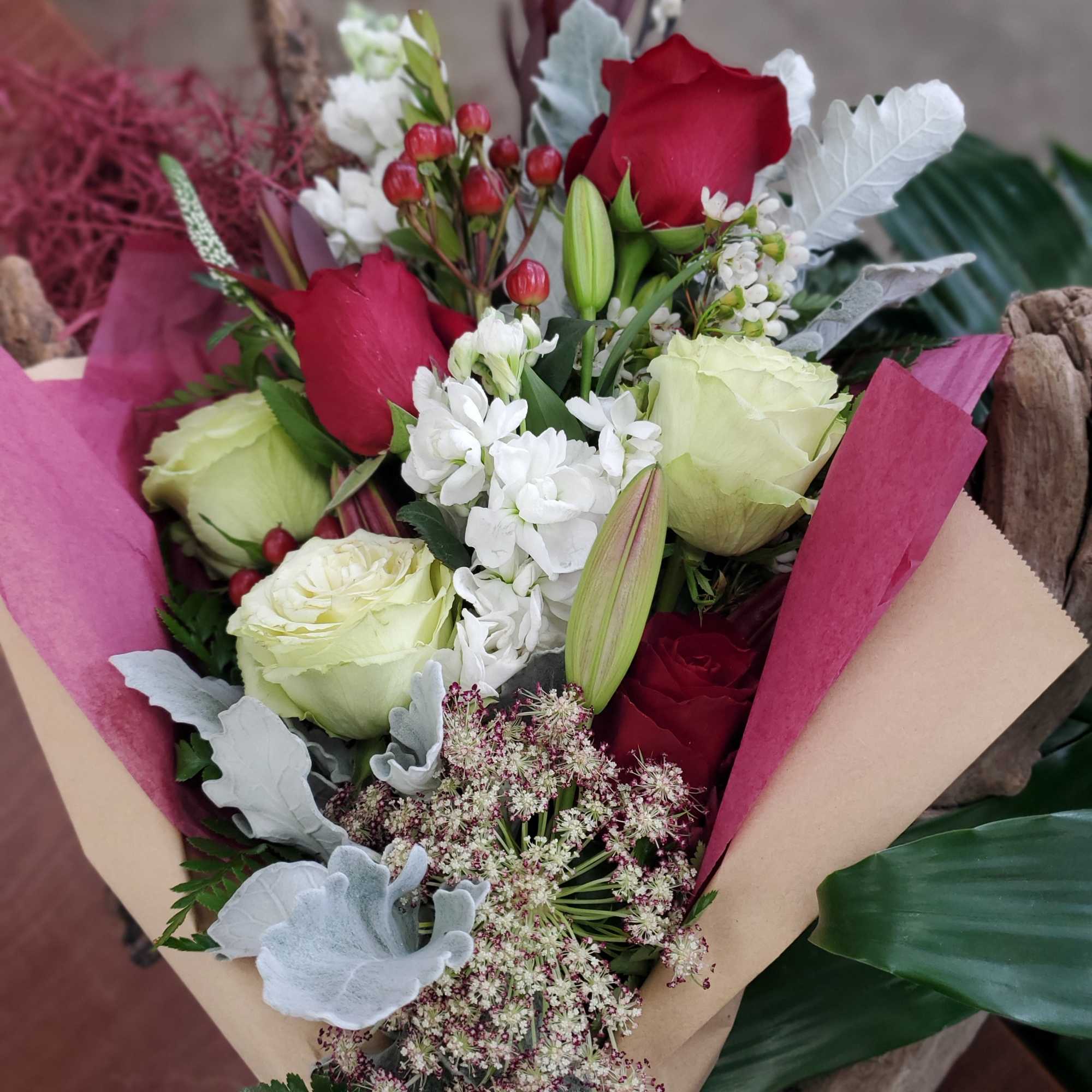 Bouquet of red and pale yellow roses with white filler flowers