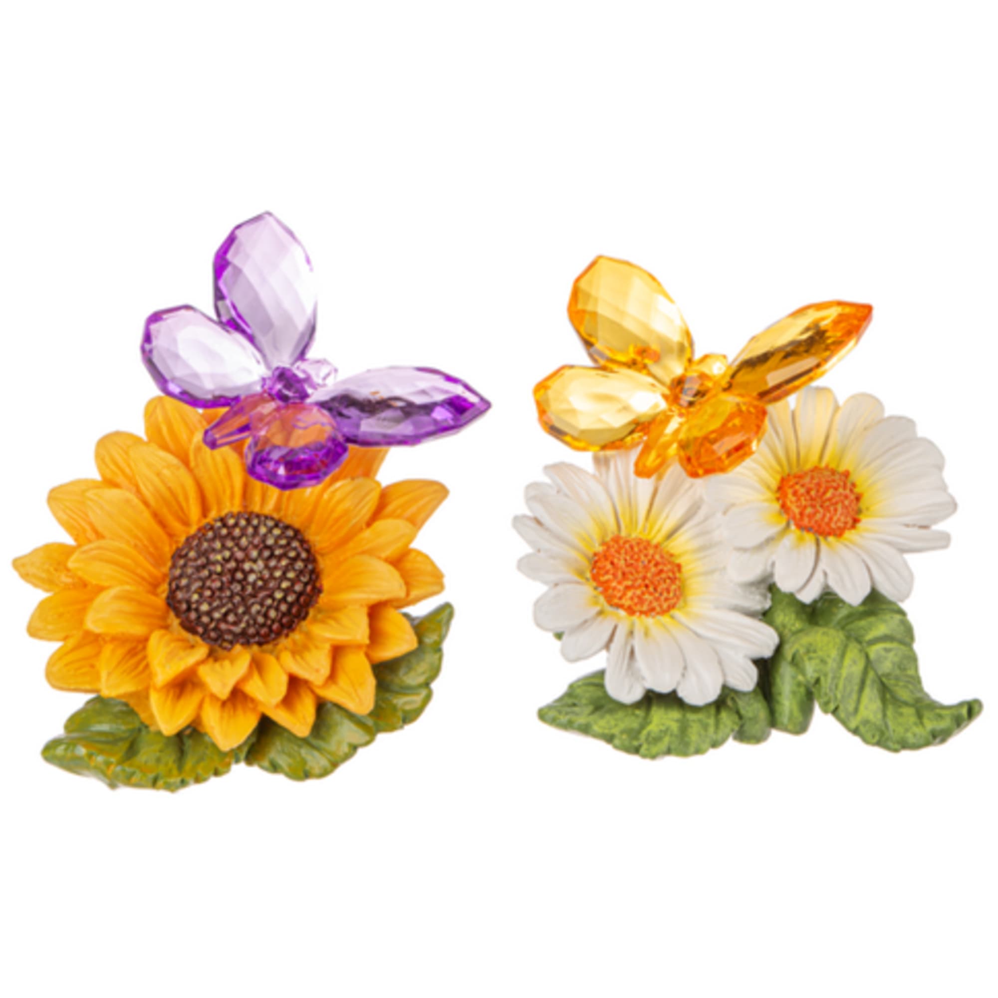Two small floral figurines with sunflowers and daisies topped by butterfly accents