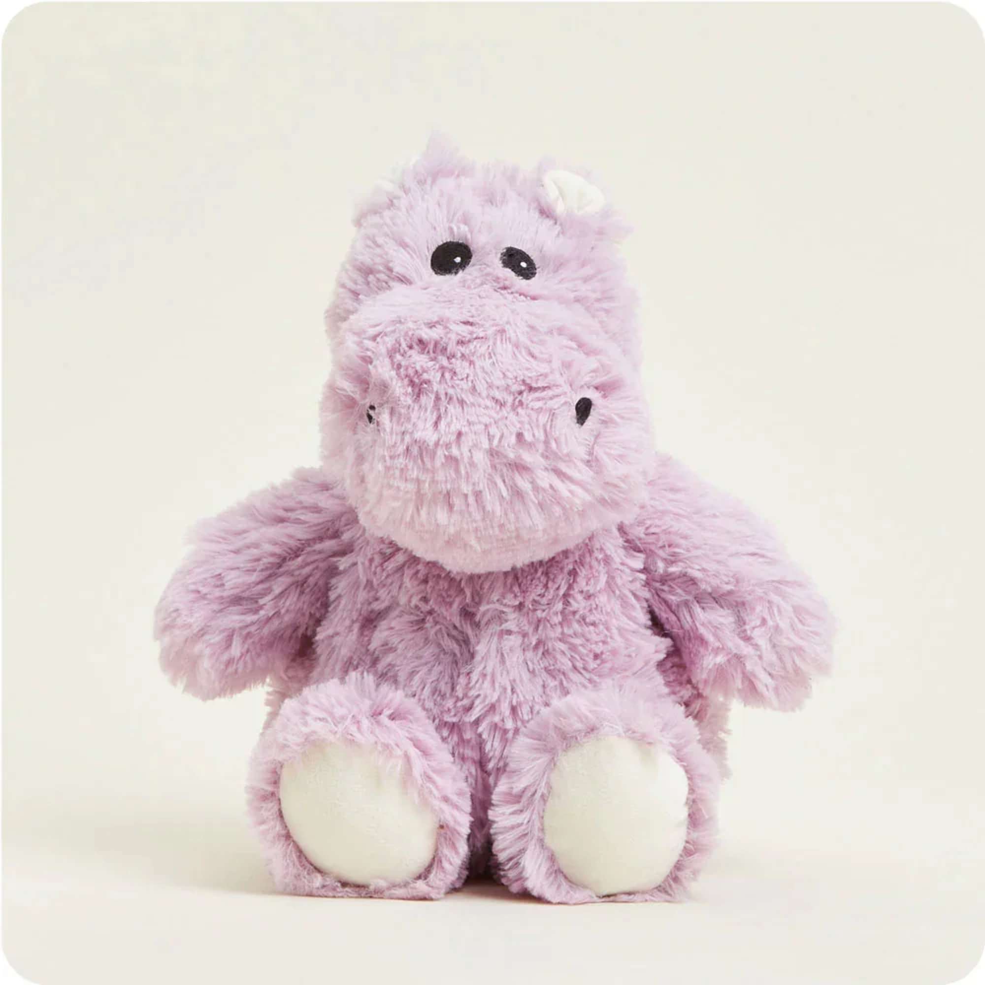 Pink plush hippo stuffed animal on a plain background