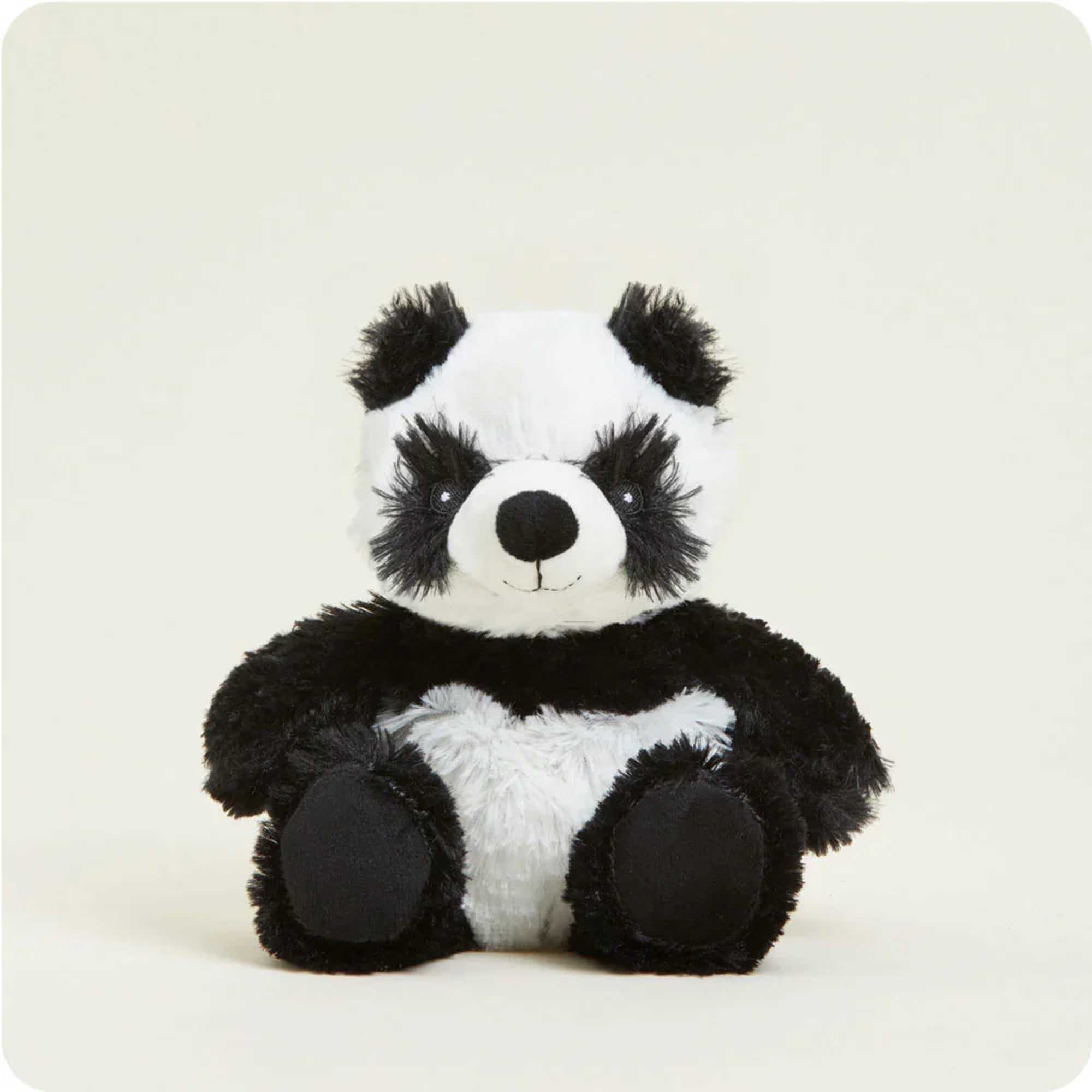 Black-and-white plush panda bear sitting upright