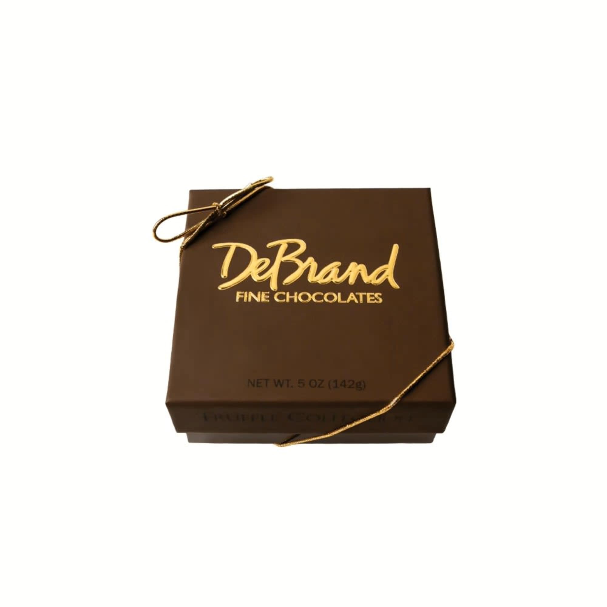 Brown box of DeBrand fine chocolates tied with gold ribbon
