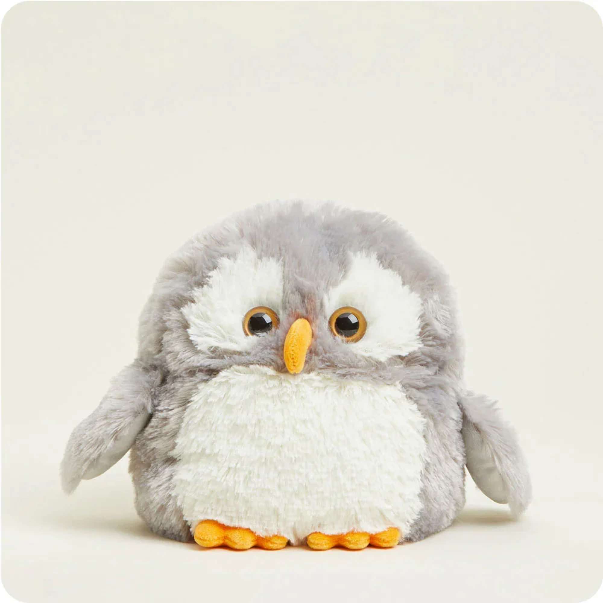Plush gray and white owl toy with orange beak and feet