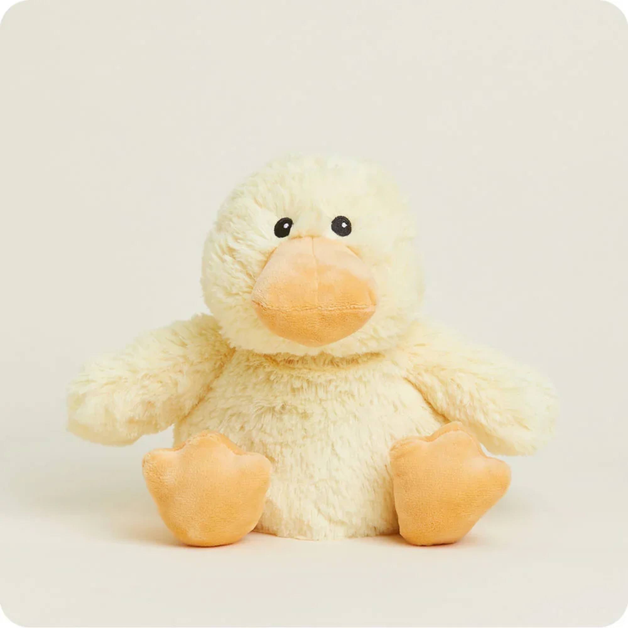 Plush yellow duck with orange beak and feet