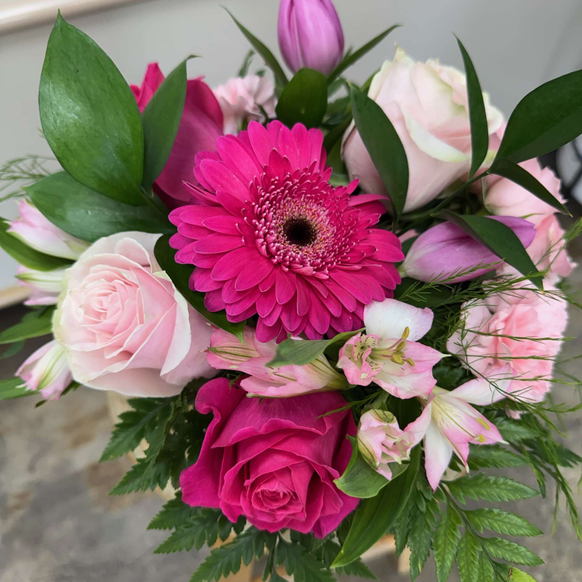 A glamorous collection of pink flowers such as roses, gerbera daisies, minicarnations, photo 2 of 4