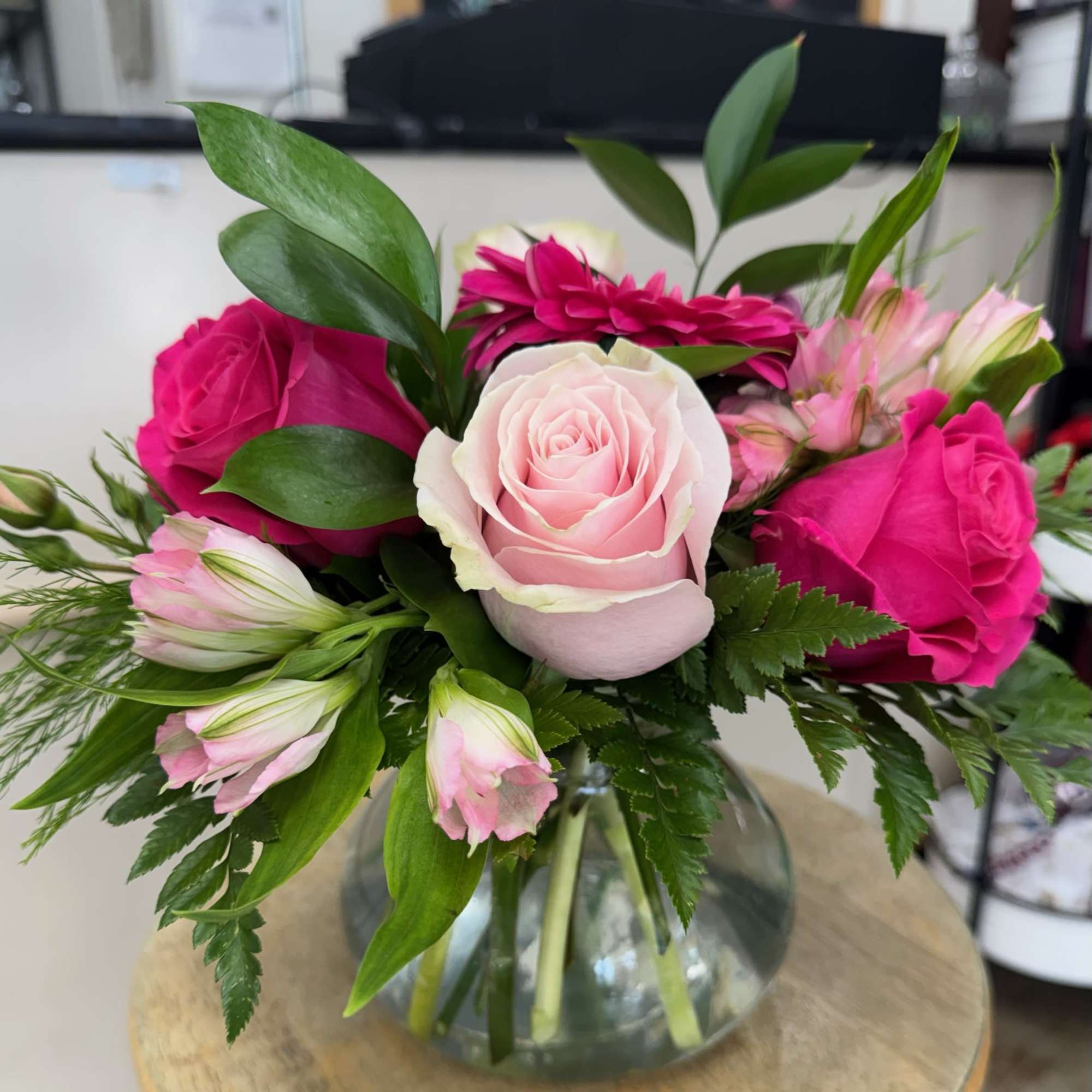 A glamorous collection of pink flowers such as roses, gerbera daisies, minicarnations, photo 3 of 4