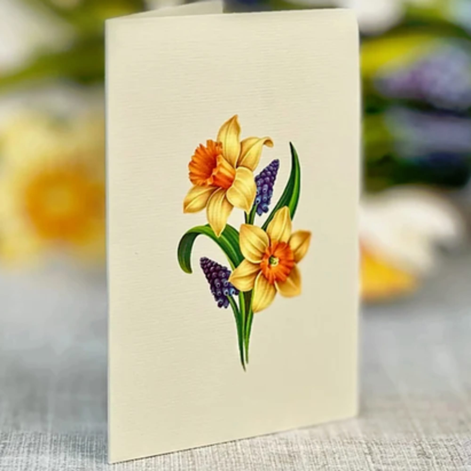 Cream greeting card with a floral illustration on the front