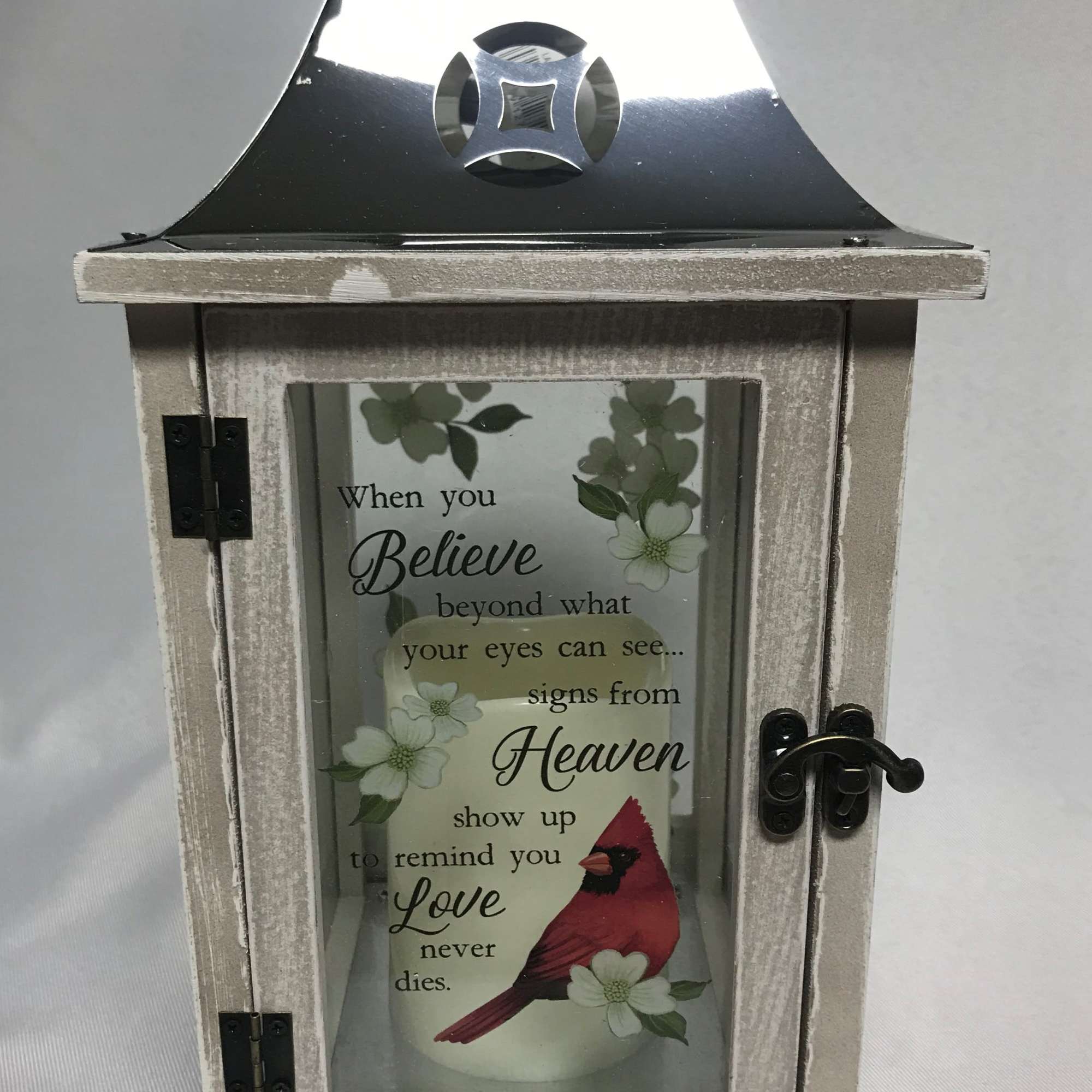 Decorative lantern with a memorial quote and cardinal design