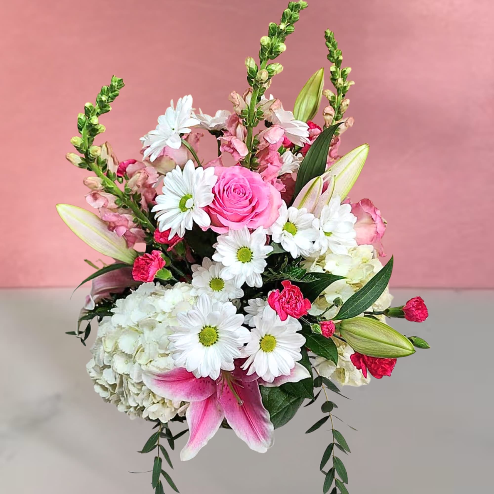 Pink and white bouquet with roses, daisies, lilies, and hydrangea