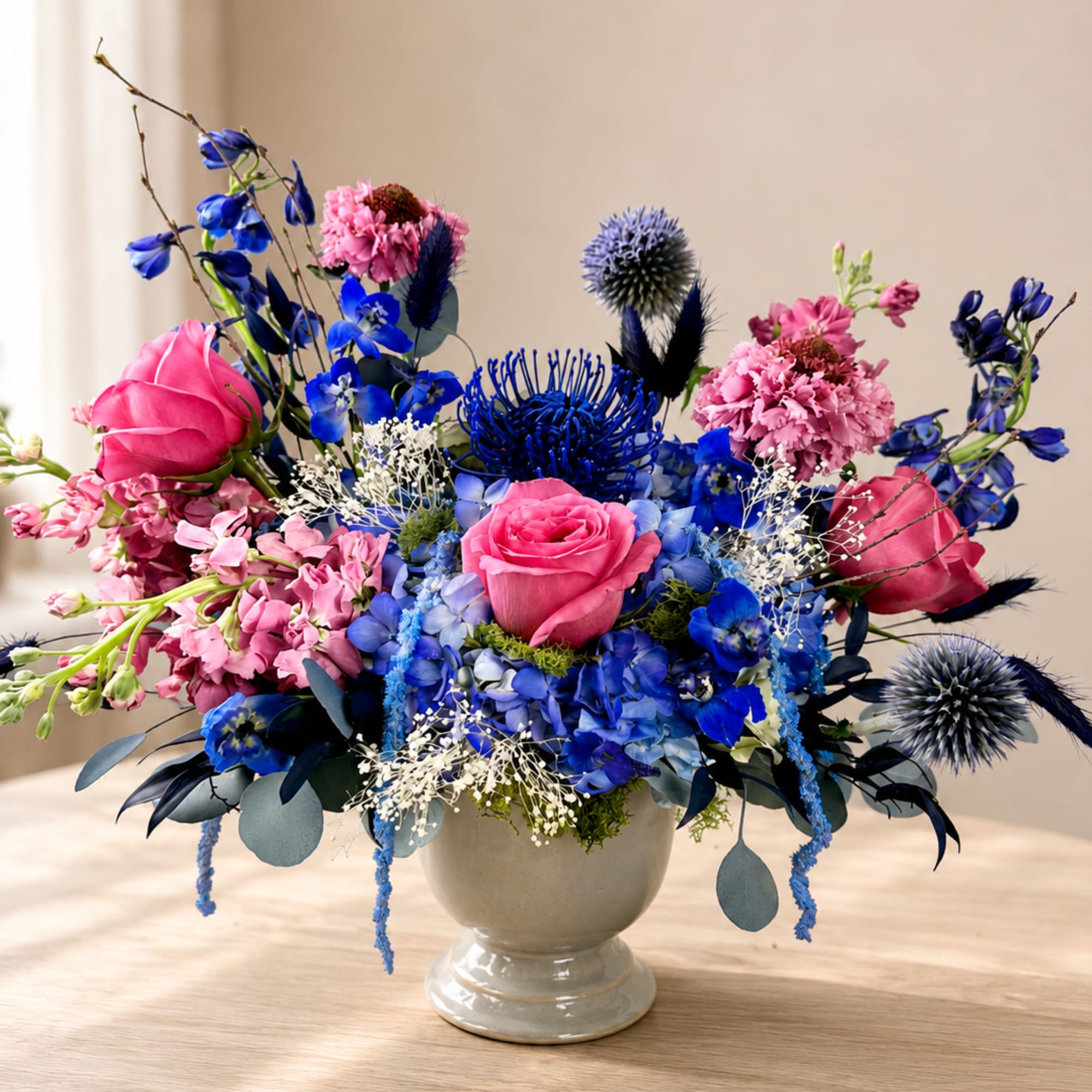 Bright, lively color pops of vivid blue and soft pink make this