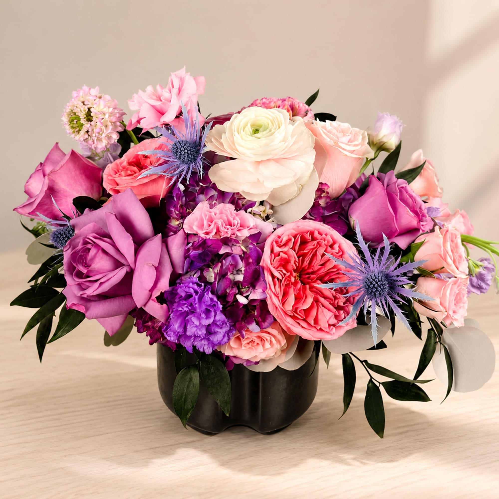 A lavish cluster of pink, lavender, coral and white blooms packed into