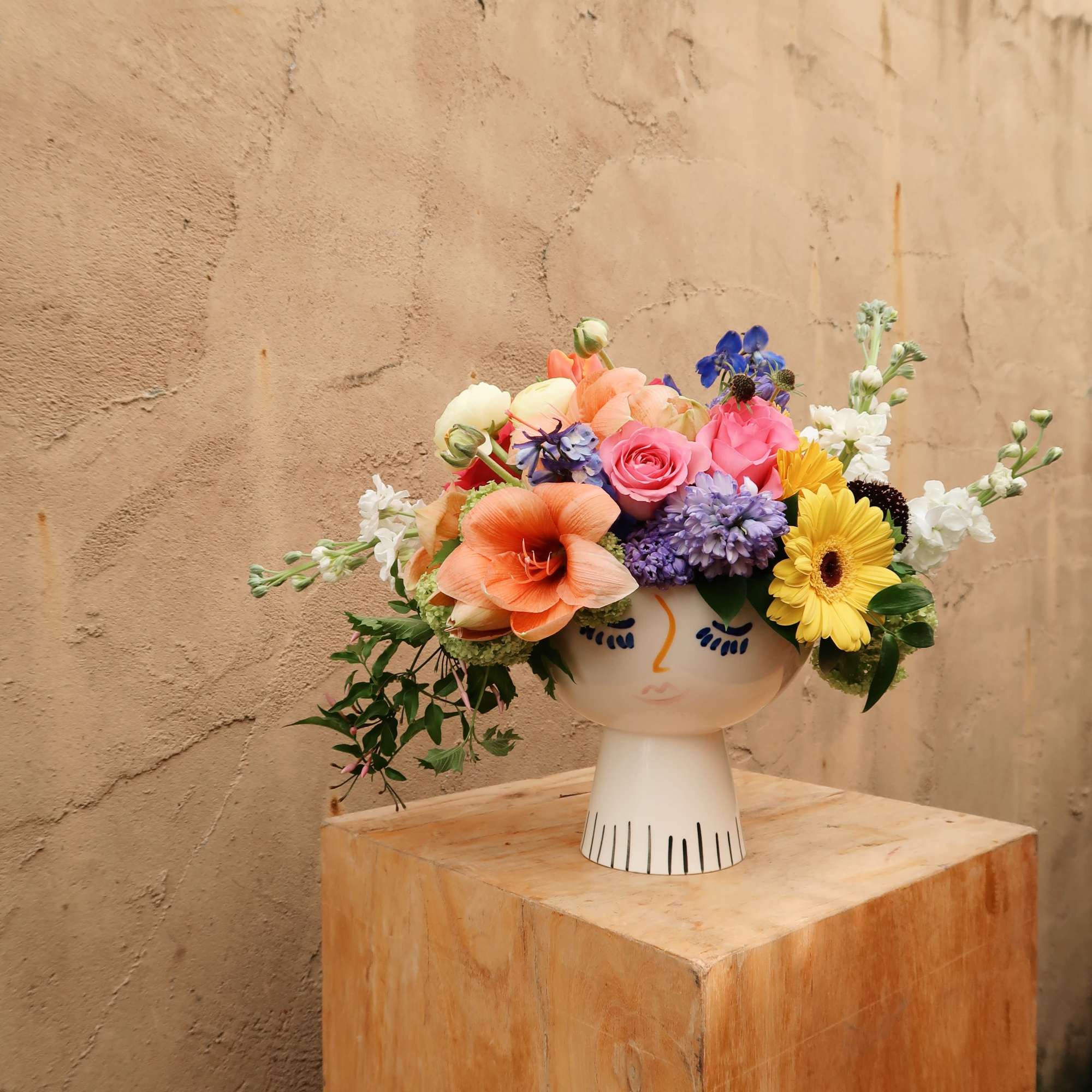 Lola face vase filled with the seasons blooms, bright and beautiful., photo 4 of 5