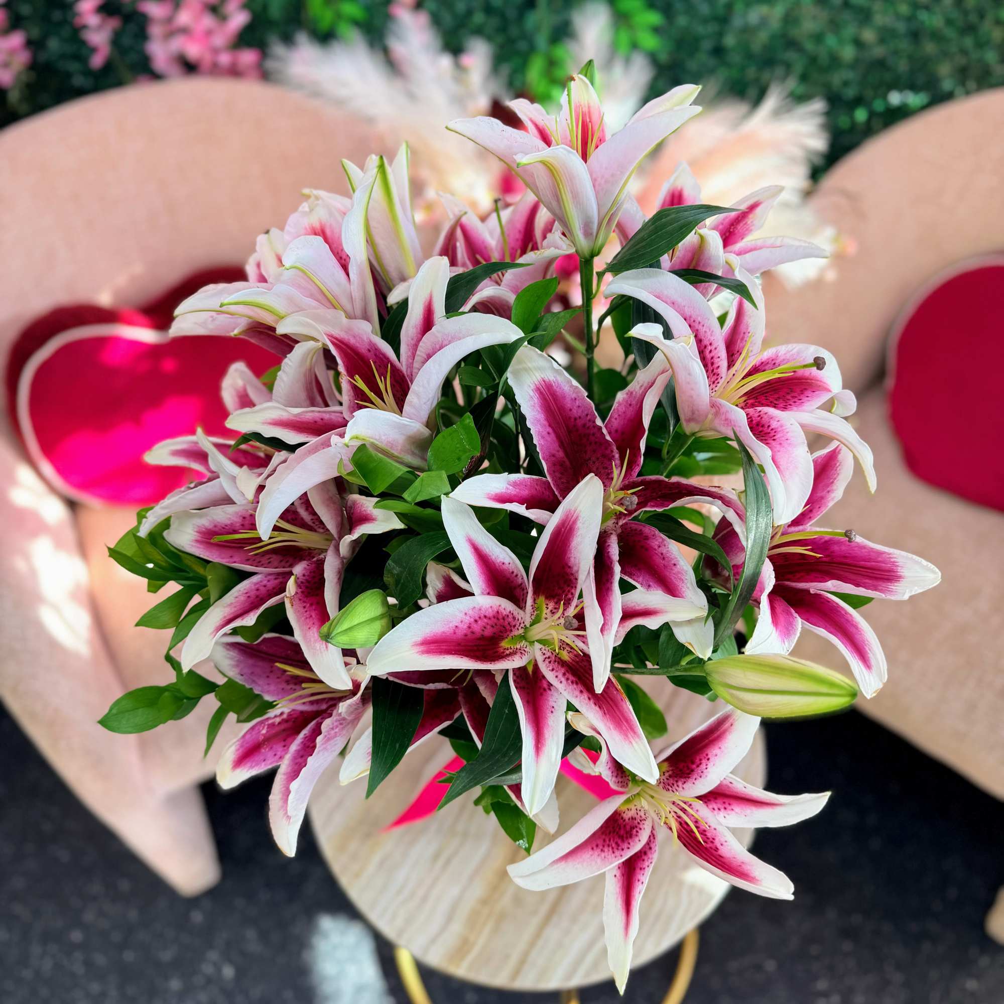 Bouquet of pink and white lilies with green buds