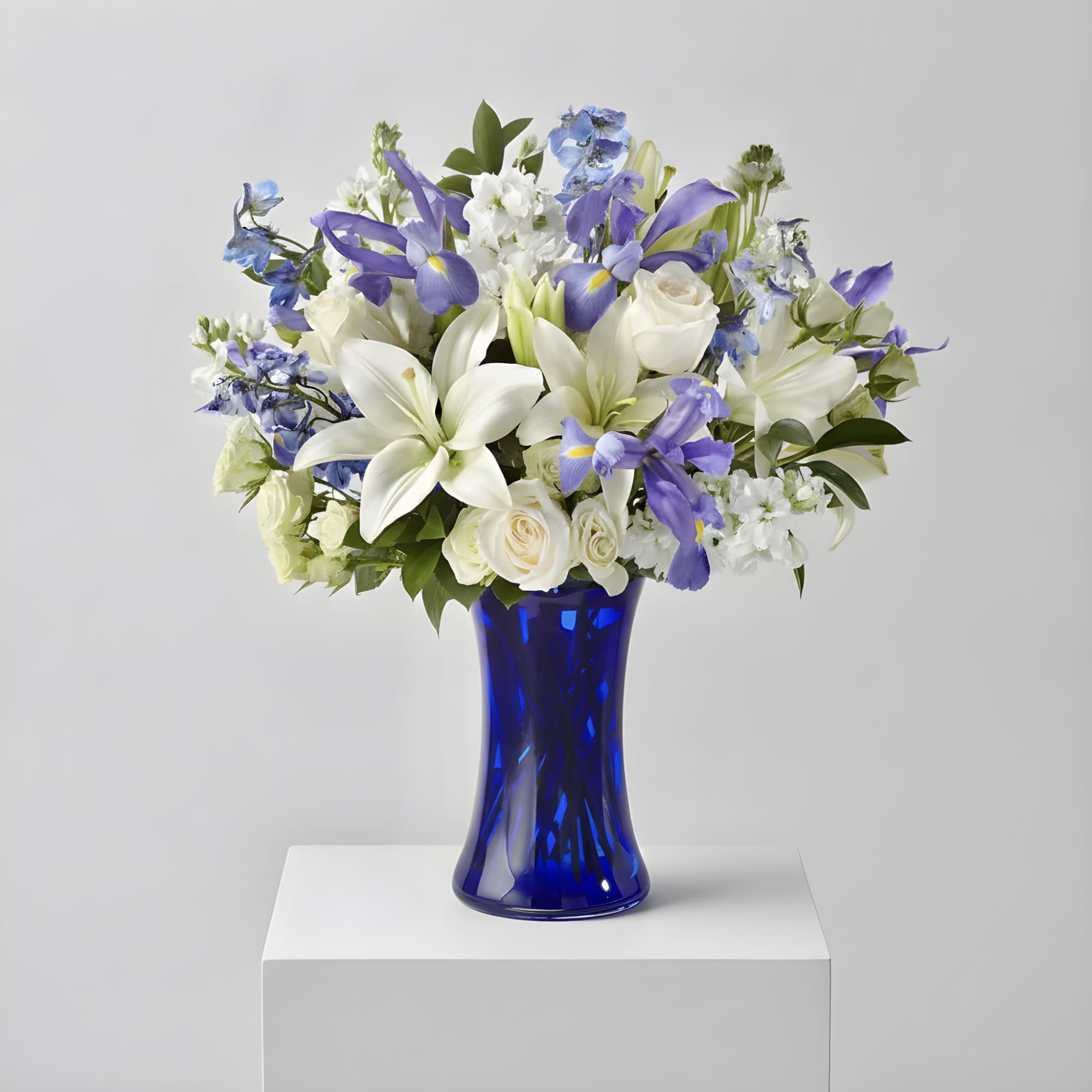 A stunning blend of blue and white blooms artfully arranged to create