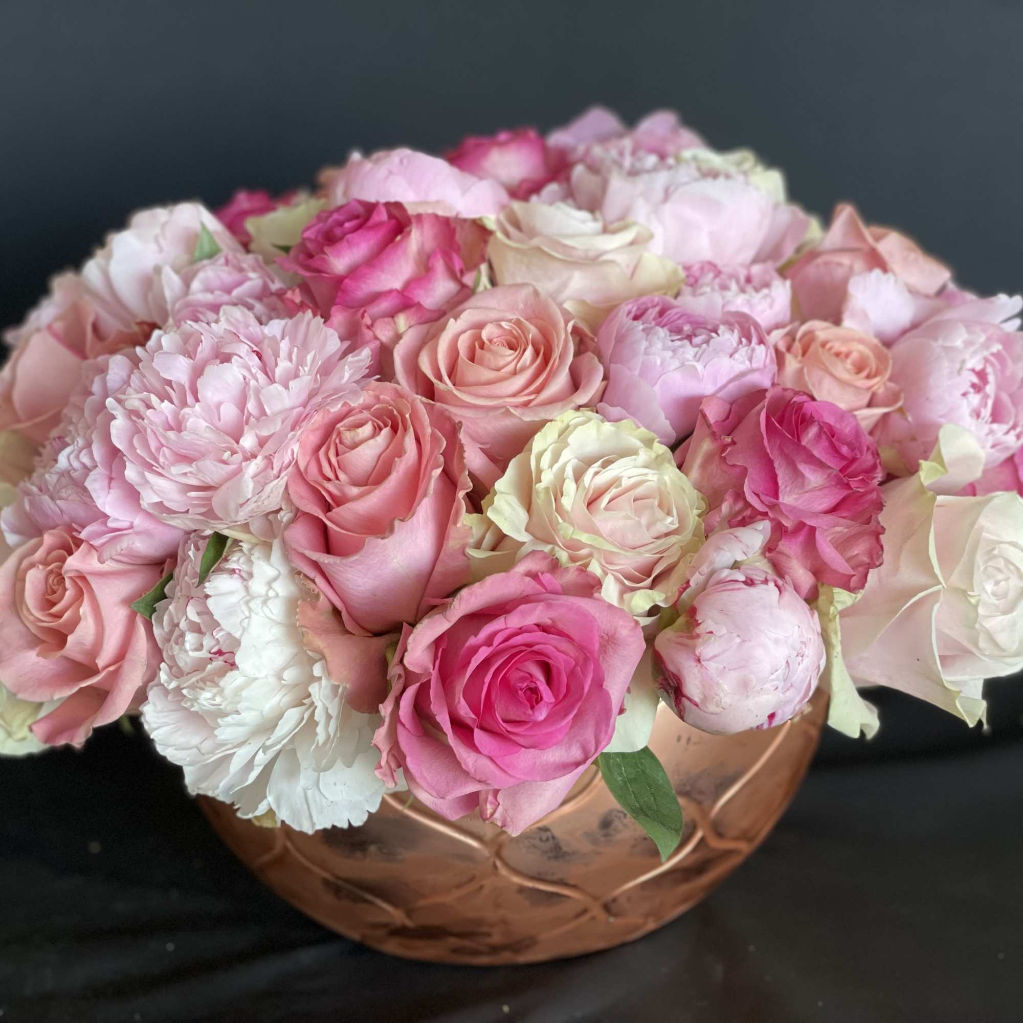 30 pink peonies surrounded by 50 stunning roses in a a white