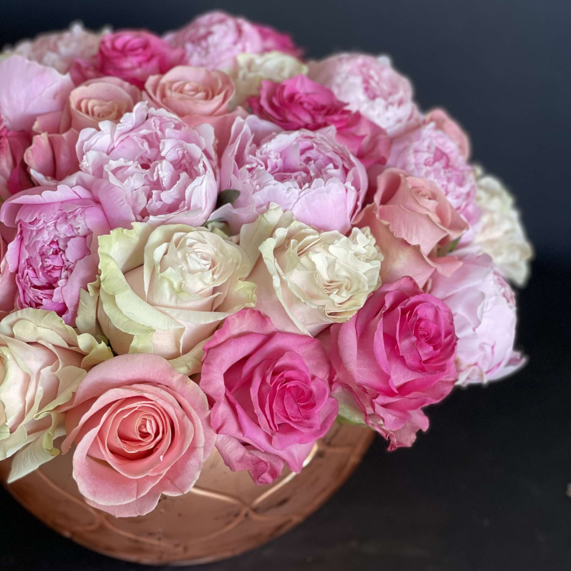 30 pink peonies surrounded by 50 stunning roses in a a white