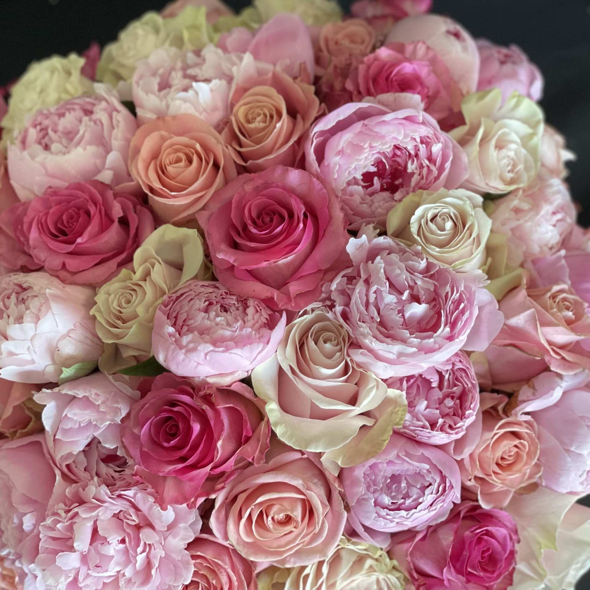 30 pink peonies surrounded by 50 stunning roses in a a white