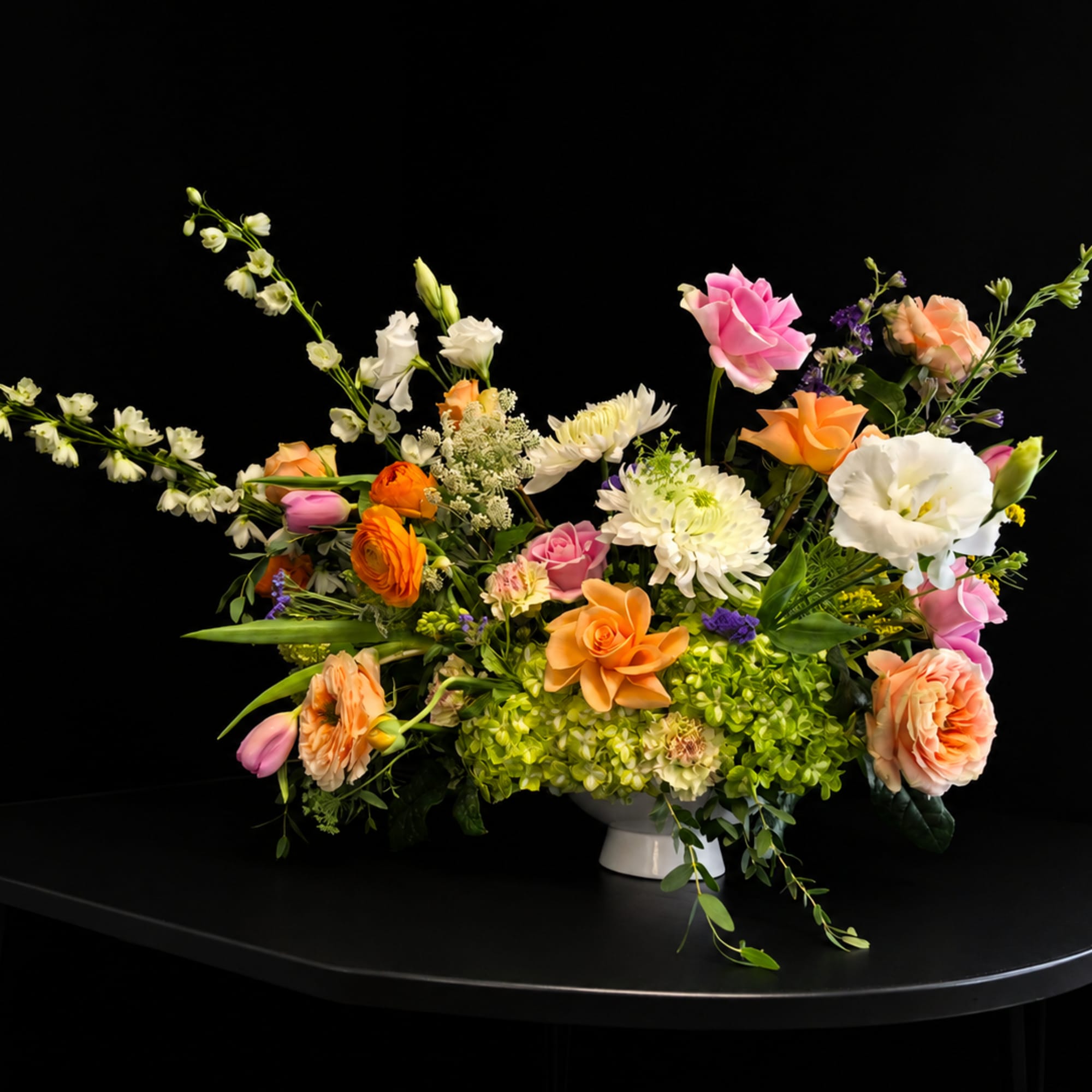 Bright, airy, and joyfully gathered &mdash; this garden-style flower arrangement is designed
