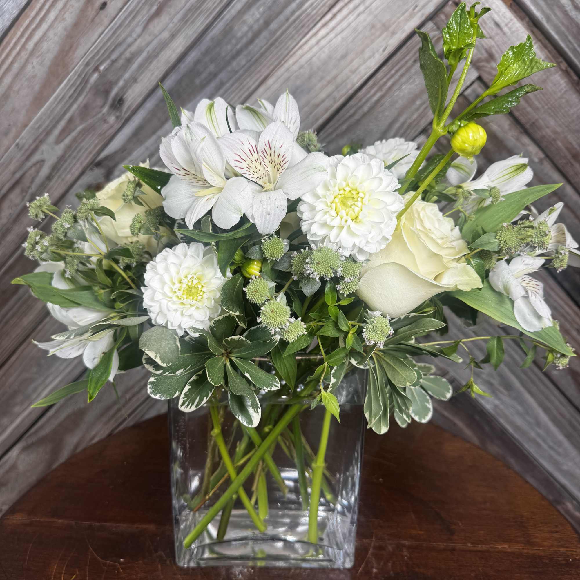 White flowers arranged in a clear glass vase