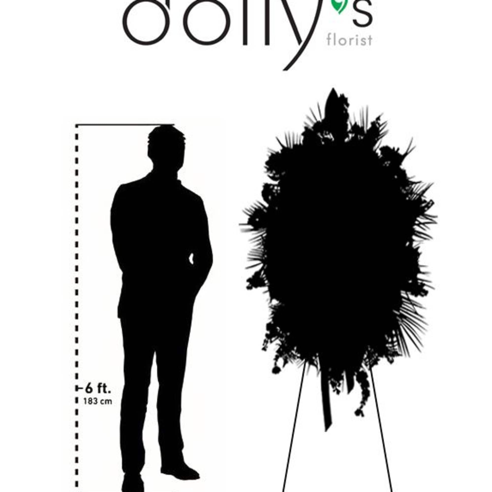 Tall standing floral spray on an easel with a human height scale