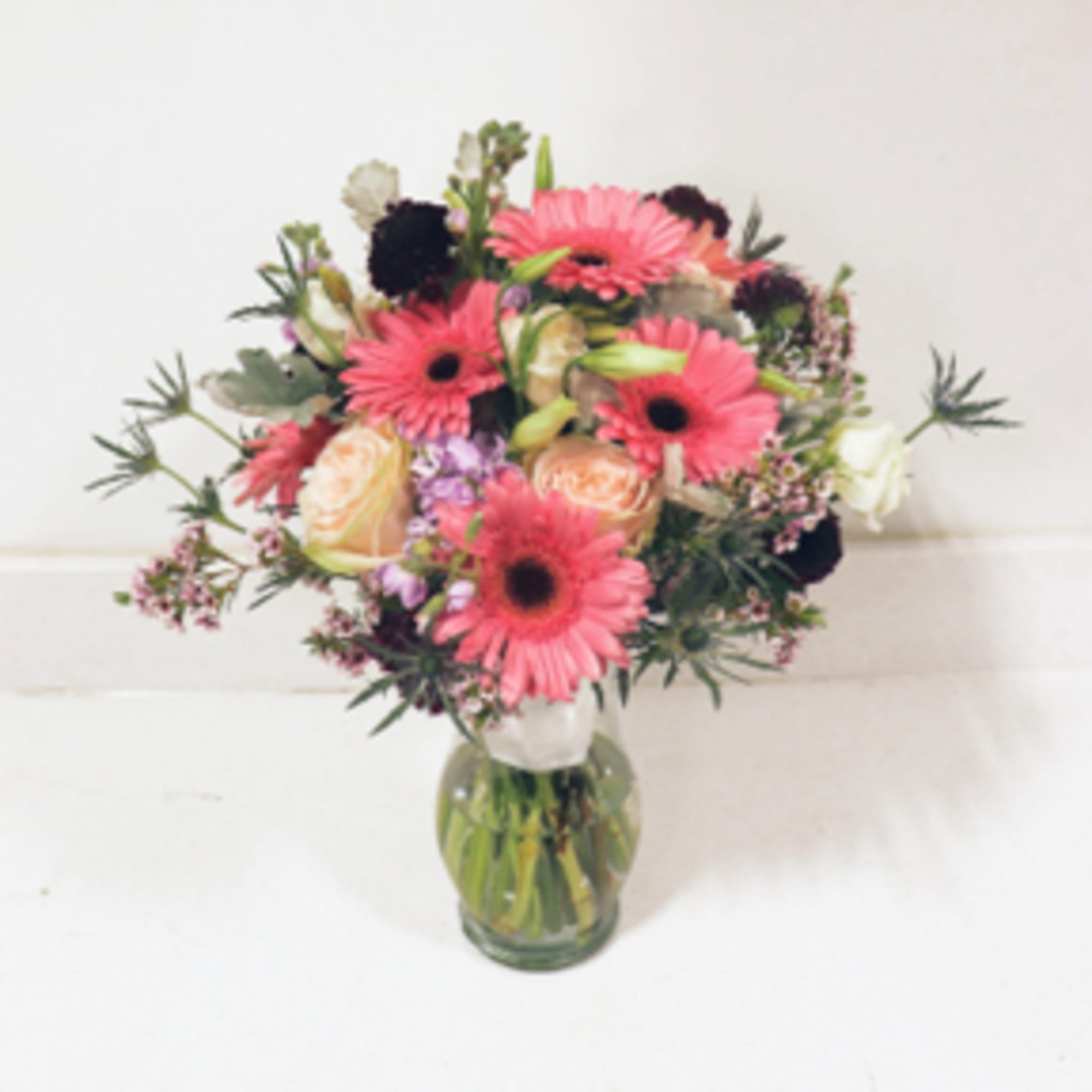 Pink gerbera daisy bouquet in a glass vase